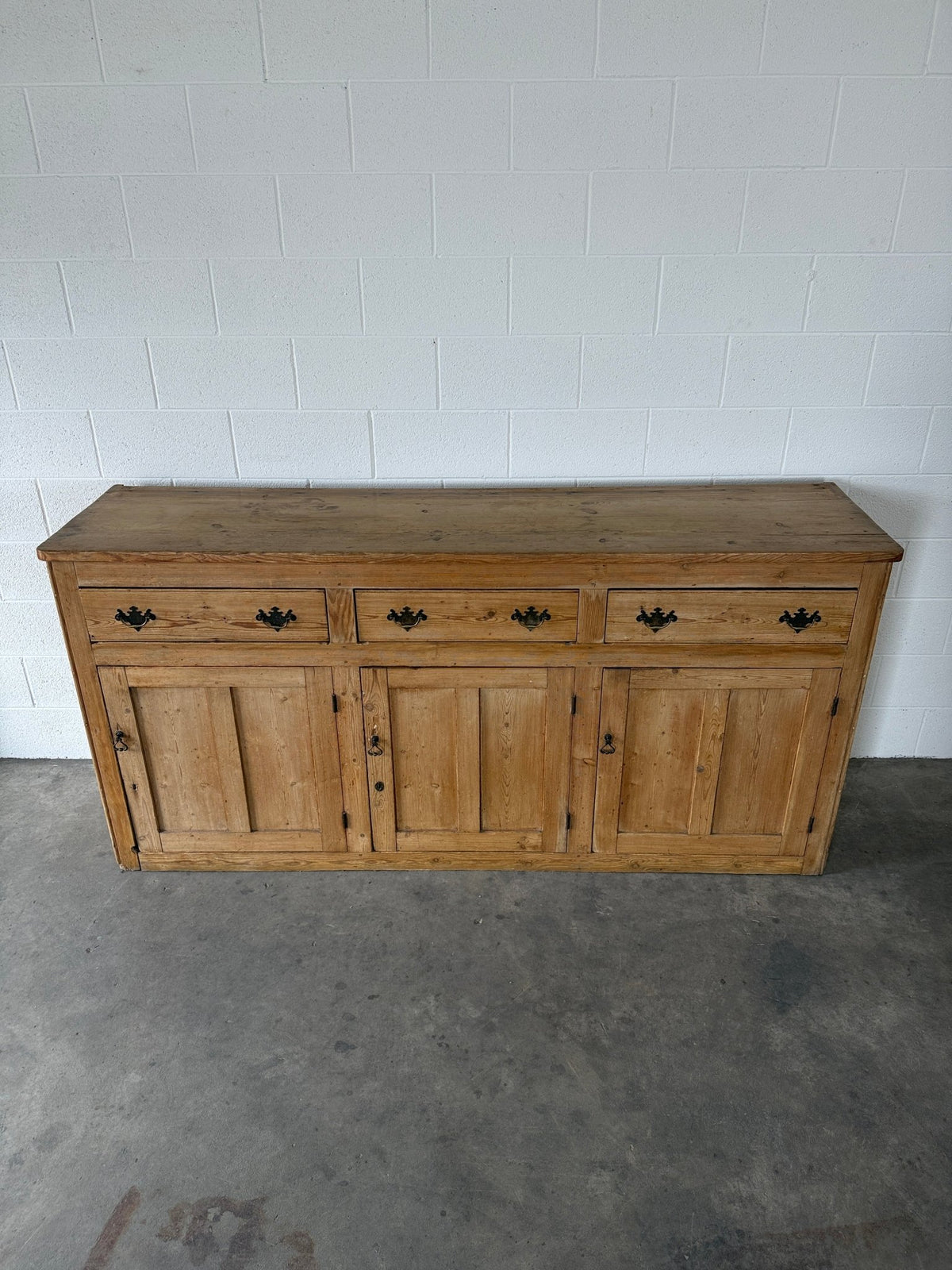 19th‑century English pine sideboard with three drawers and cupboards below - House on Horizon
