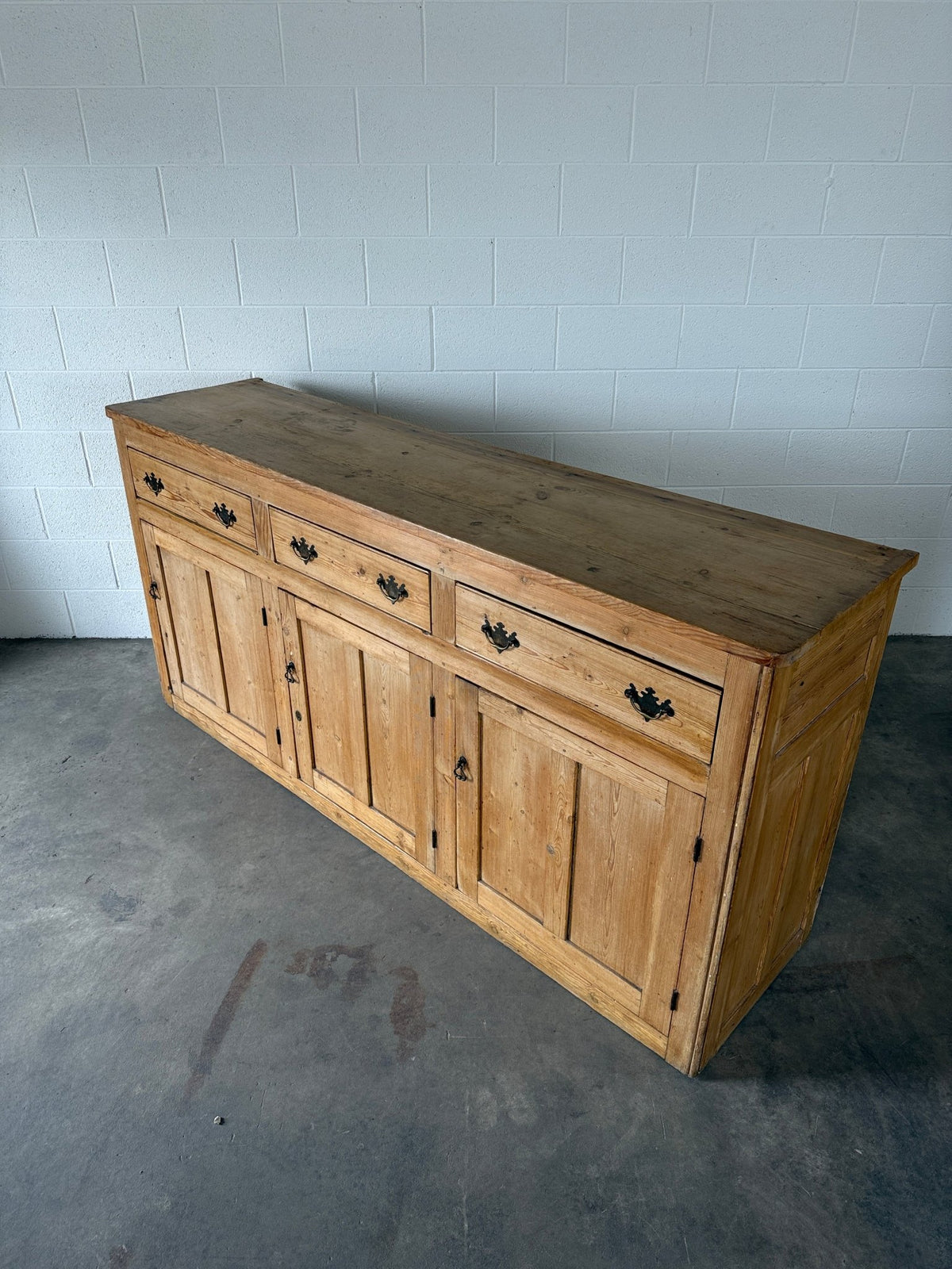 19th‑century English pine sideboard with three drawers and cupboards below - House on Horizon
