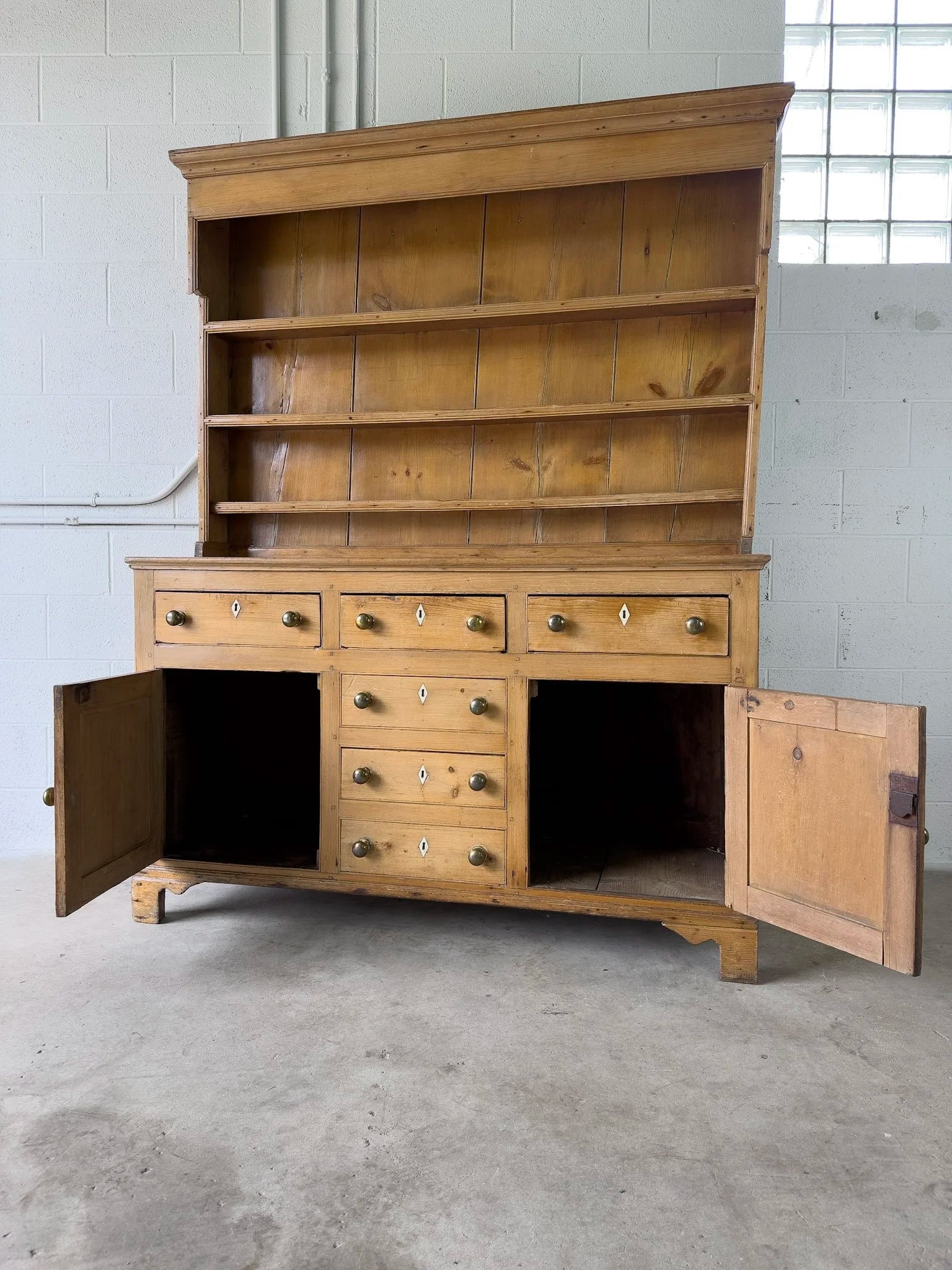 Antique English kitchen dresser with warm patina