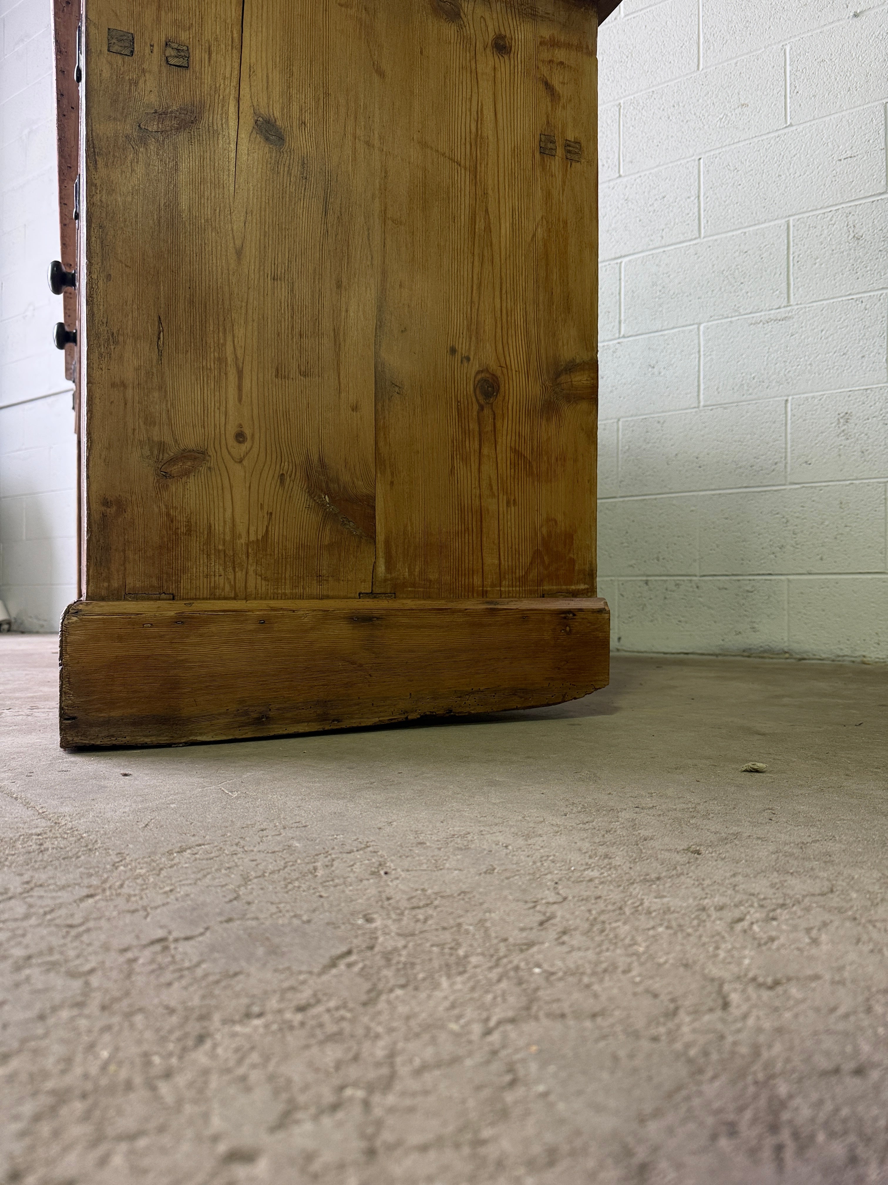 Antique English pine sideboard with open storage