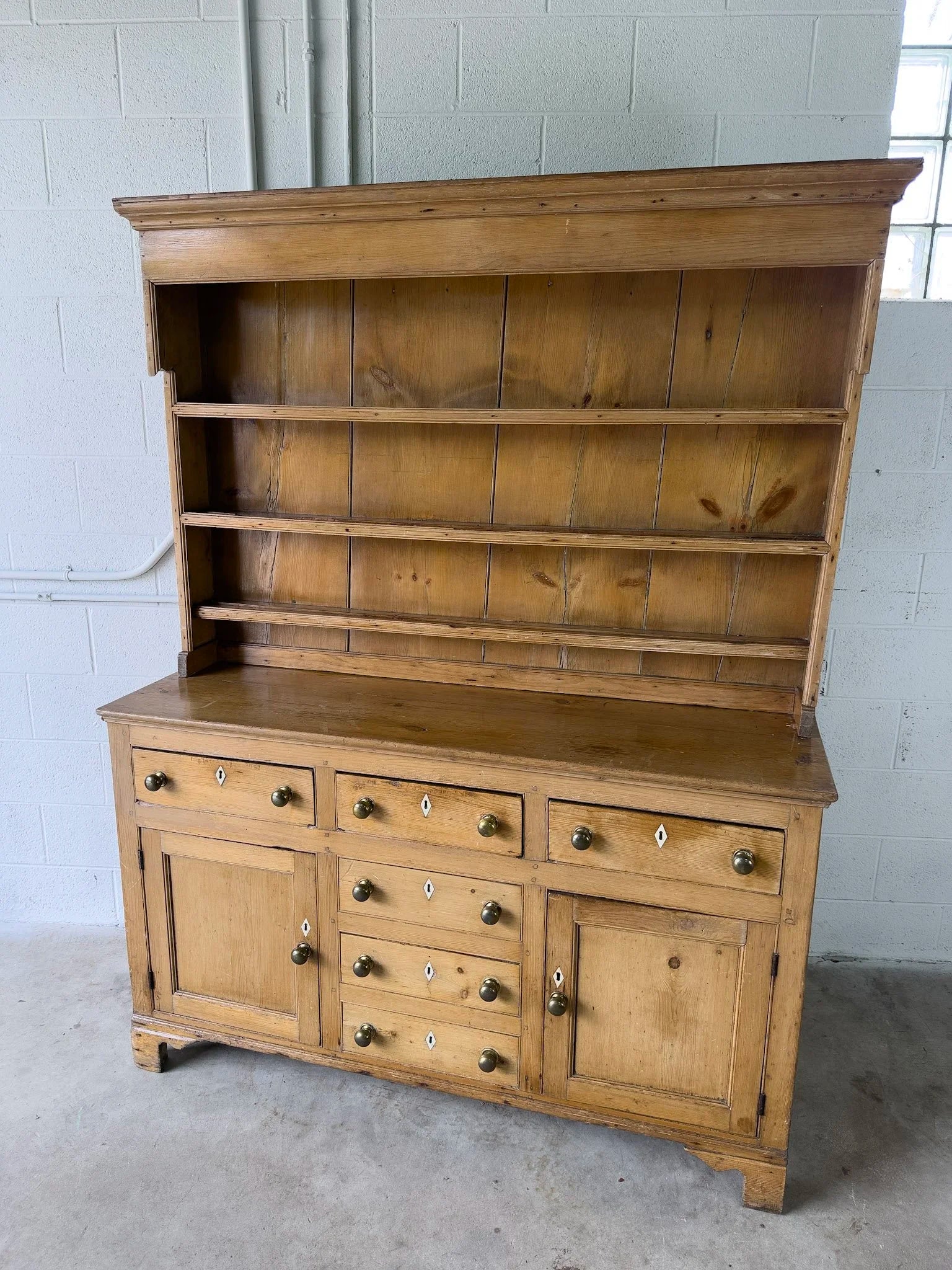 Antique English kitchen dresser with warm patina