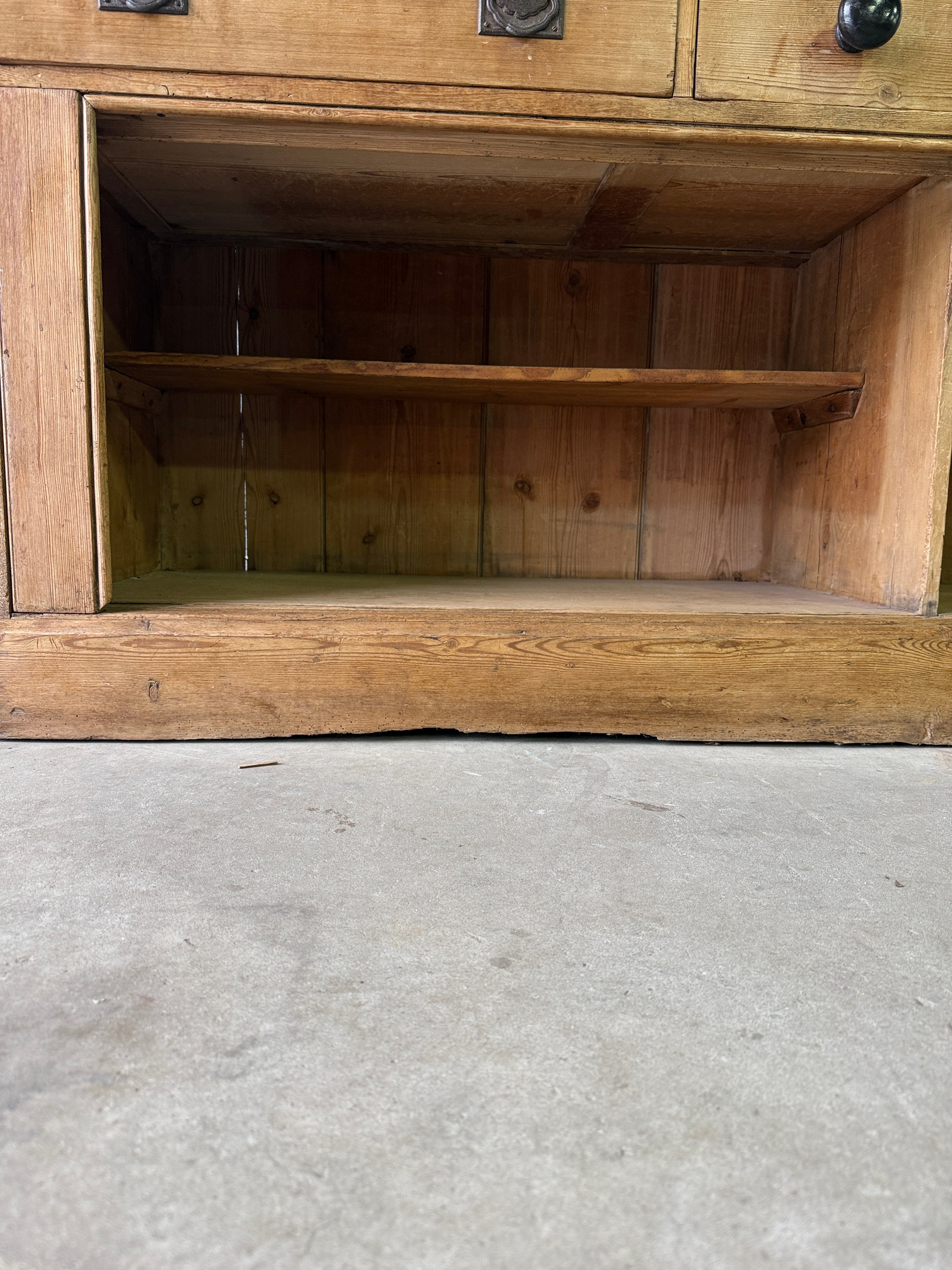 Antique English pine sideboard with open storage