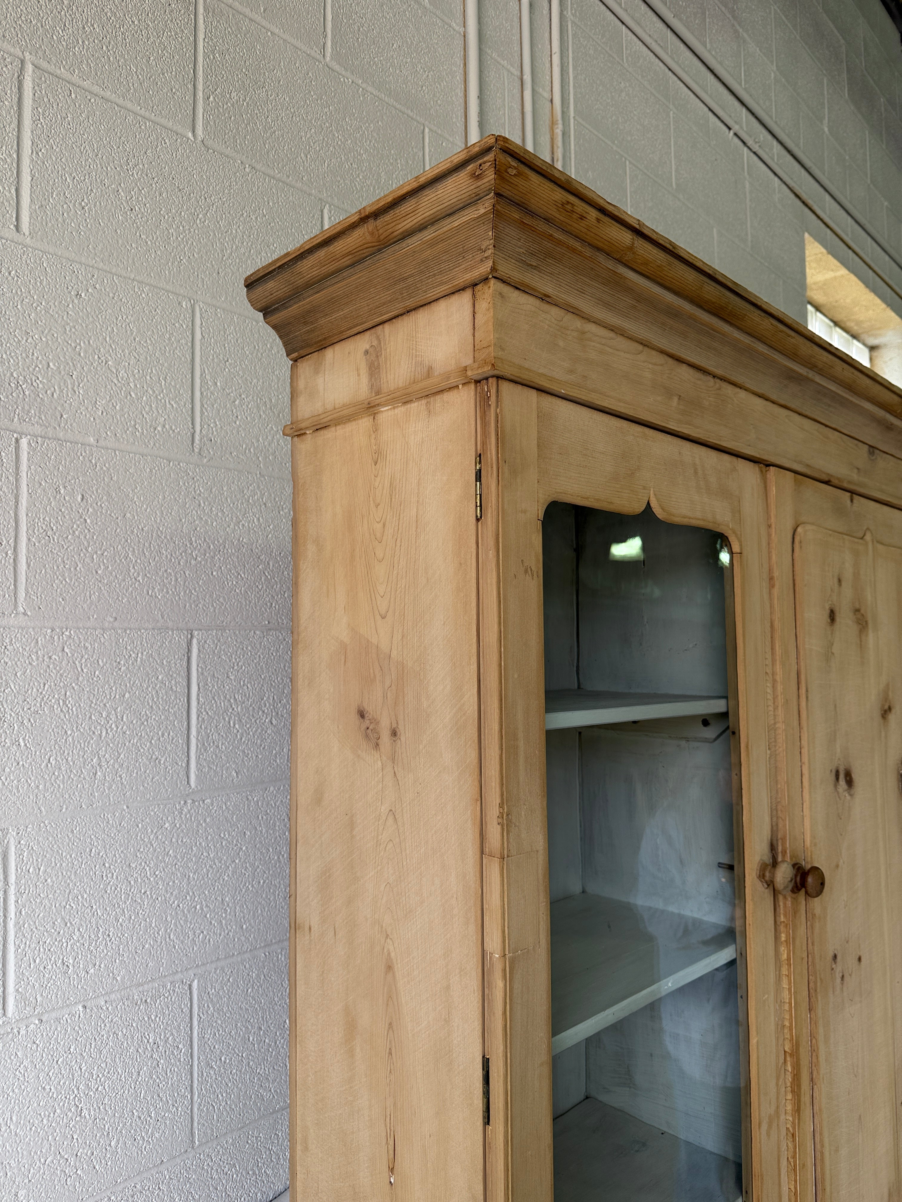Antique pine housekeepers cupboard with wavy glass