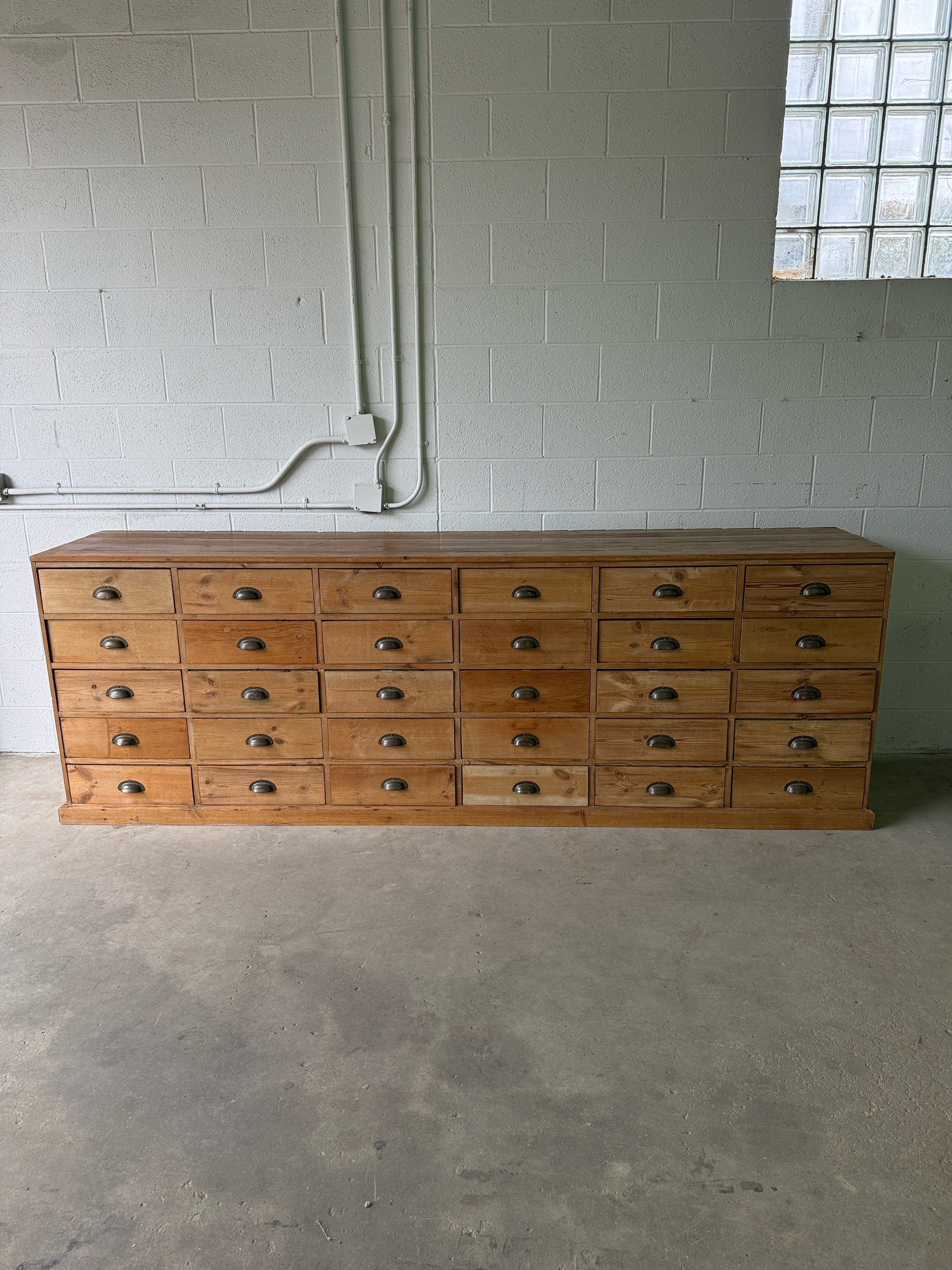 Antique European bank of haberdashery drawers