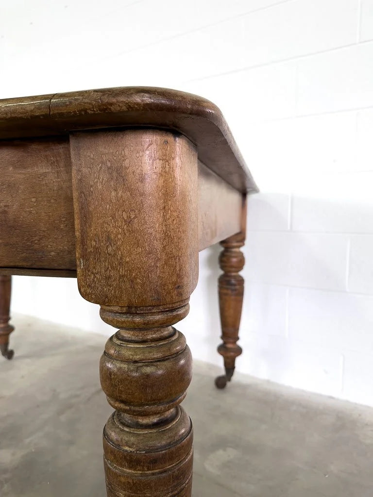 Square English breakfast table with turned legs and castors