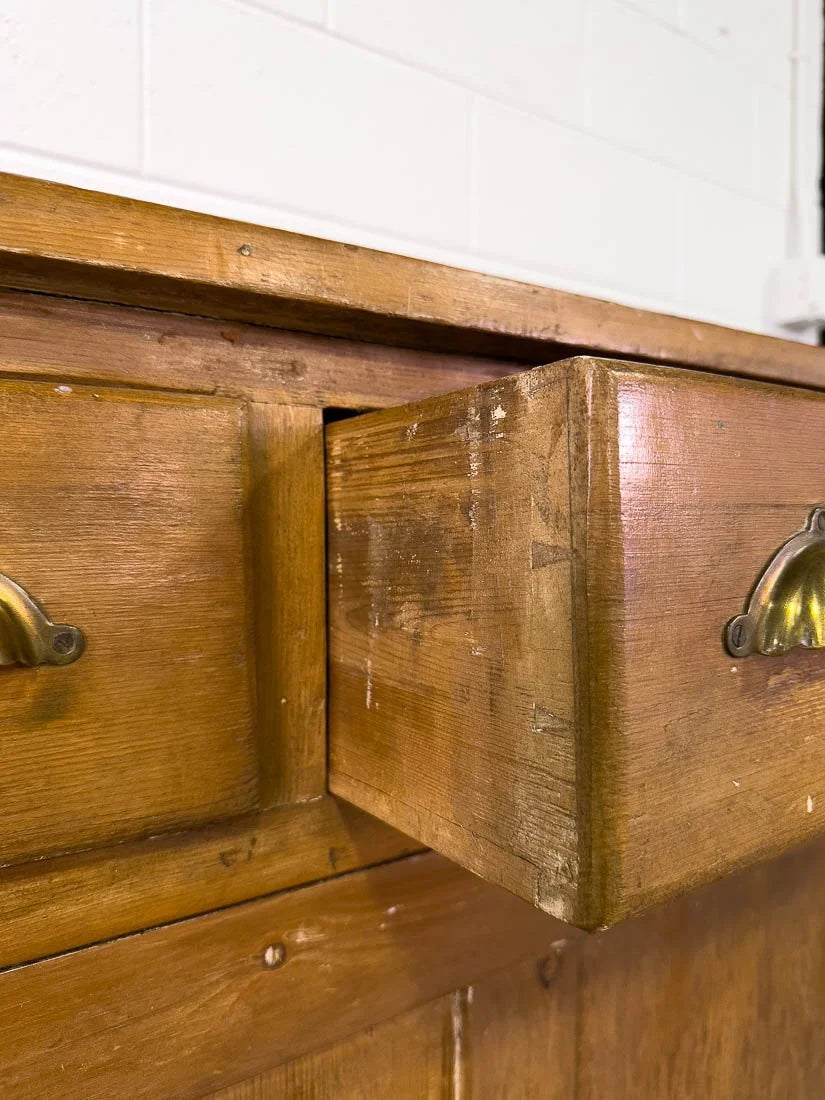 English pine sideboard with sliding doors and brass hardware
