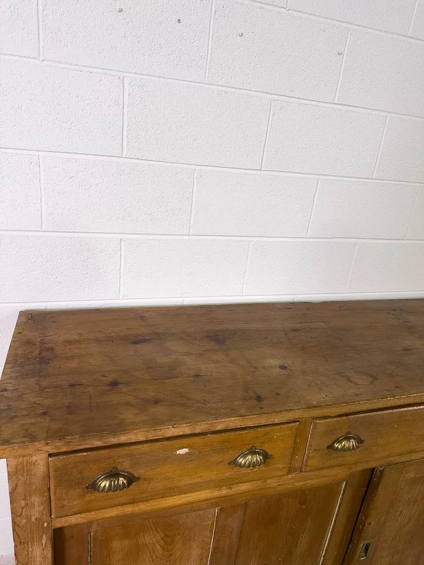 English pine sideboard with sliding doors and brass hardware