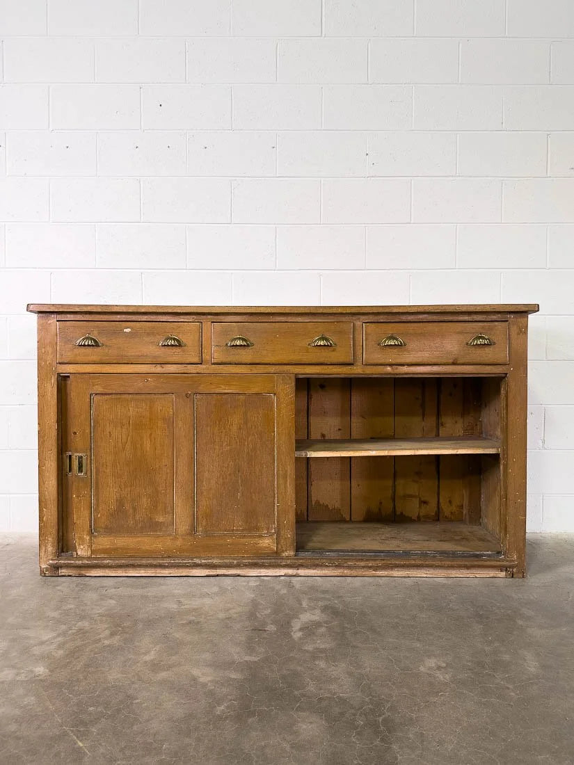English pine sideboard with sliding doors and brass hardware