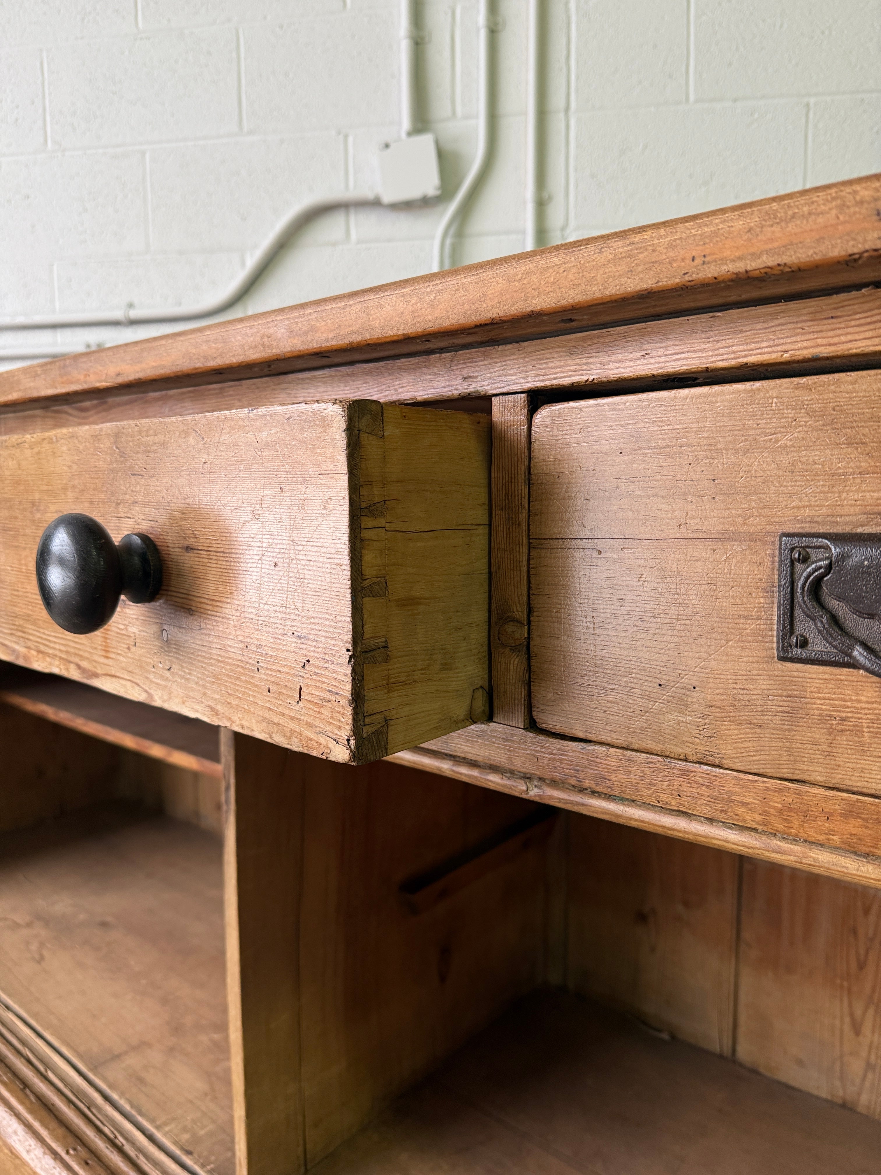 Antique English pine sideboard with open storage