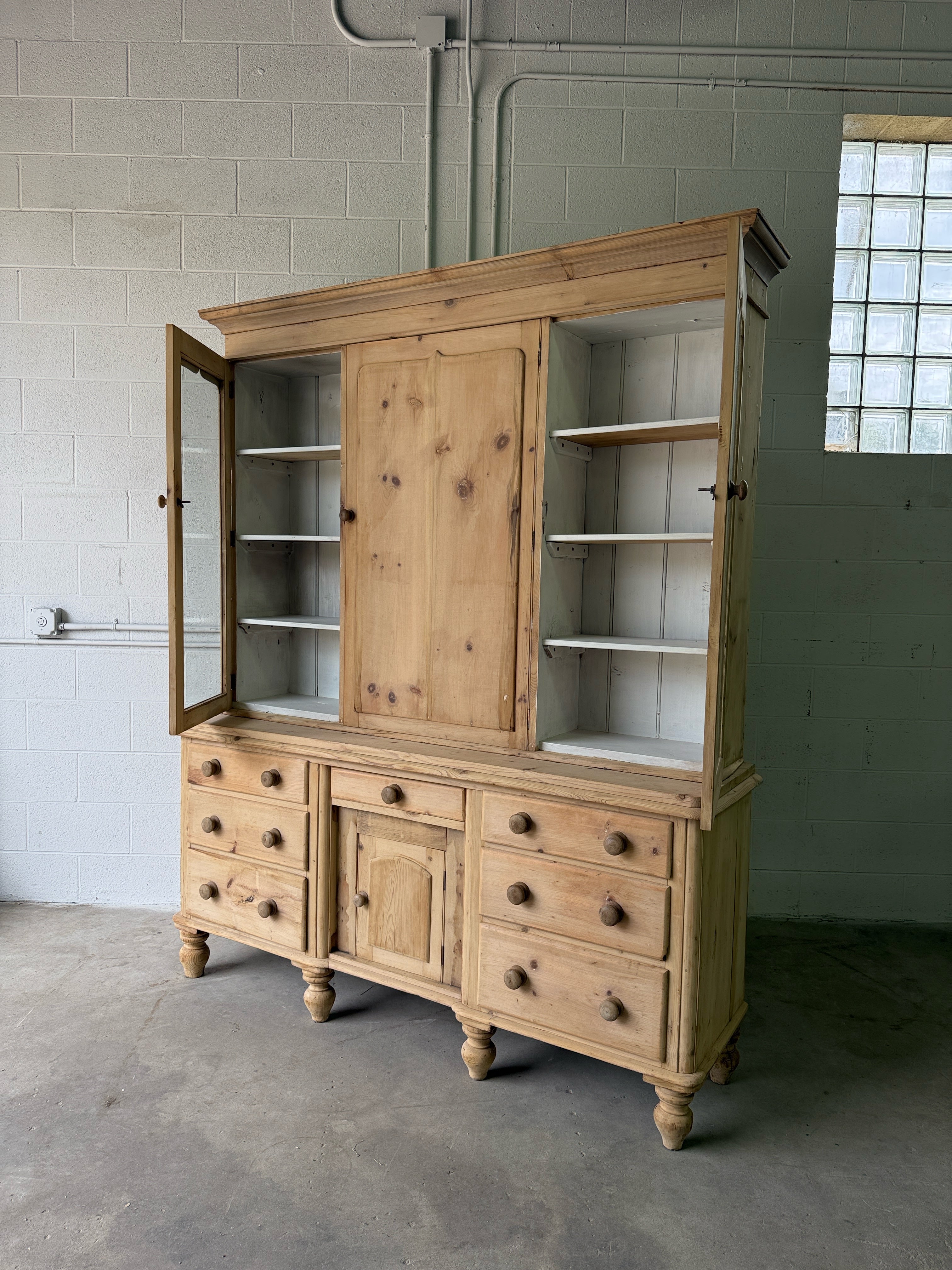 Antique pine housekeepers cupboard with wavy glass