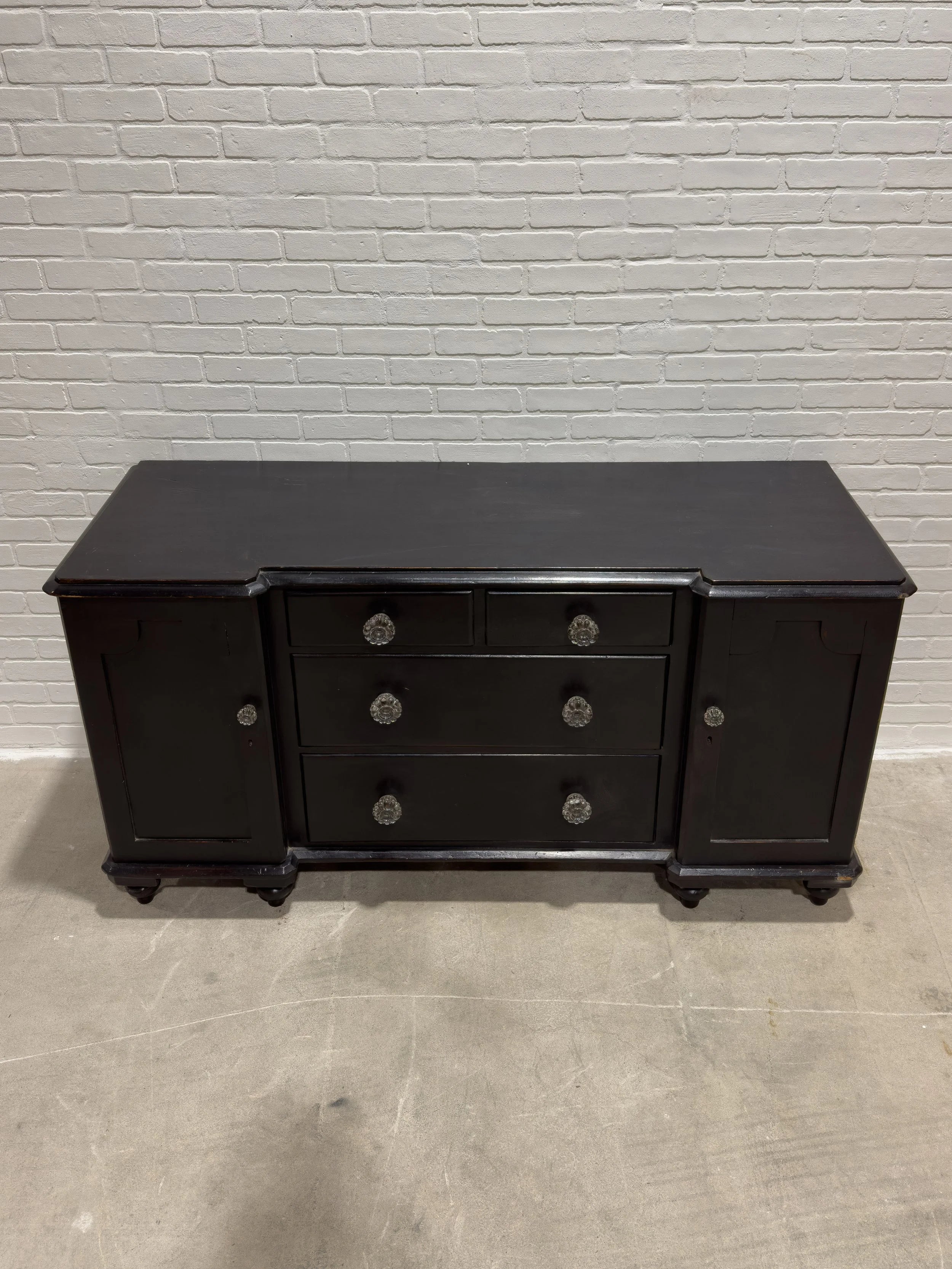 Ebonized English sideboard with glass knobs