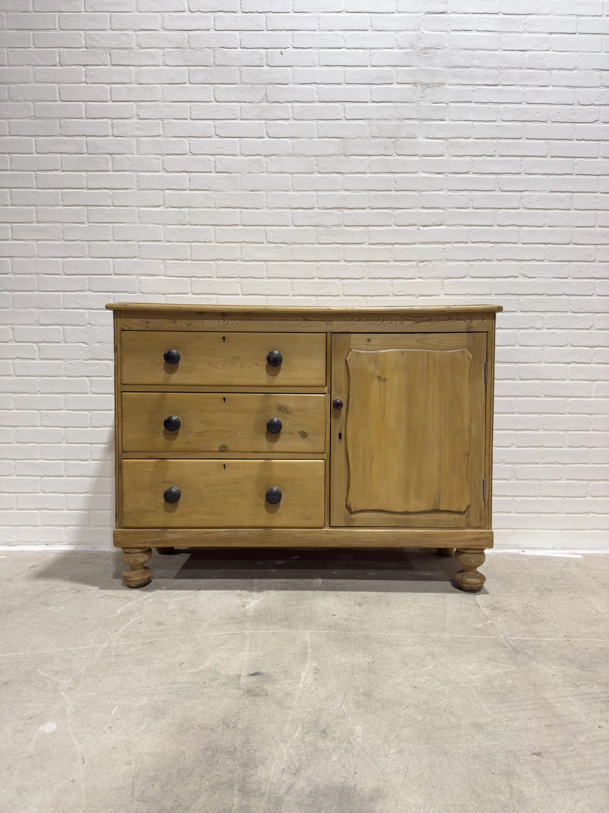 Victorian pine sideboard with dark knobs