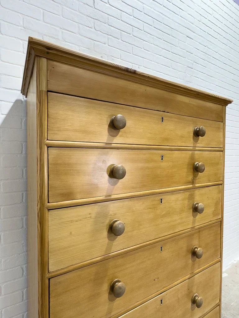Tall antique pine chest of drawers
