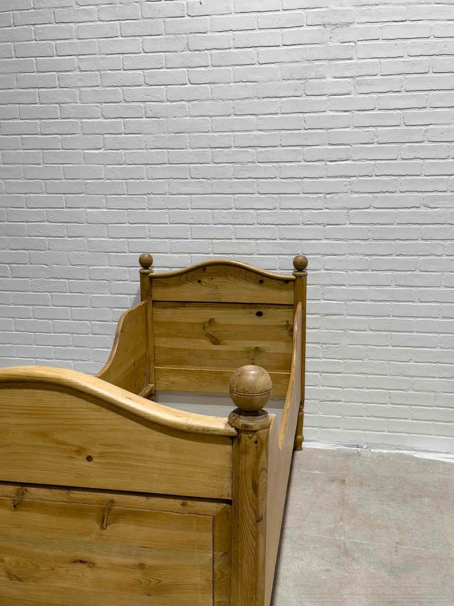 Narrow English pine sleigh bed