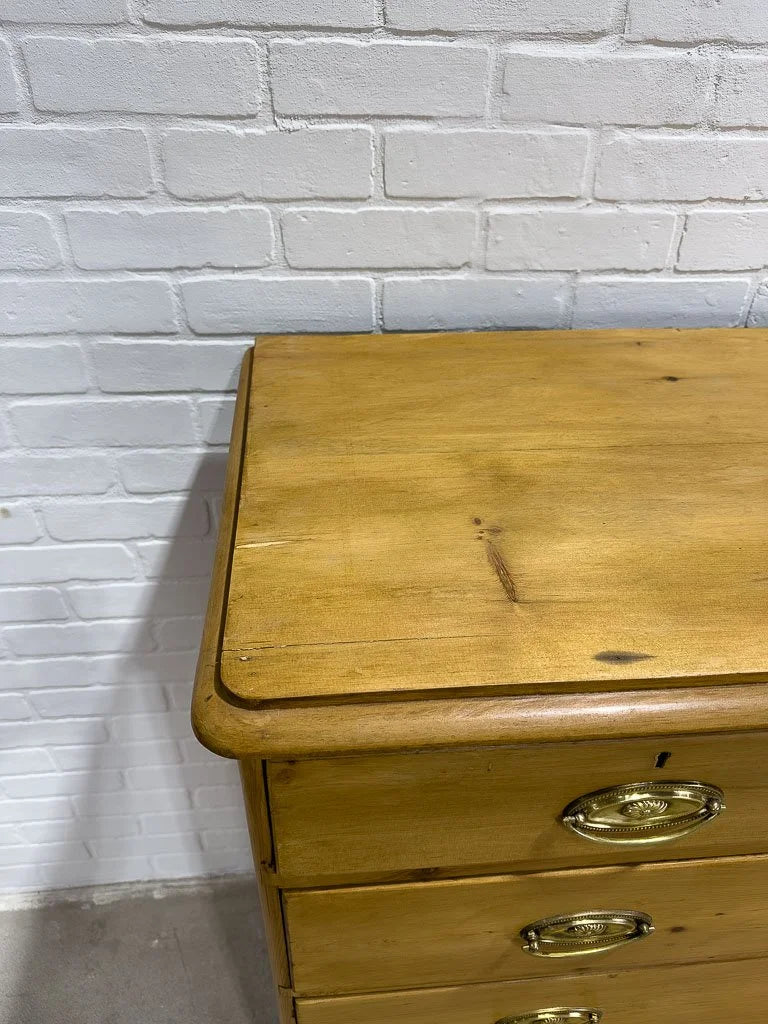 Antique English pine dresser with oval brasses