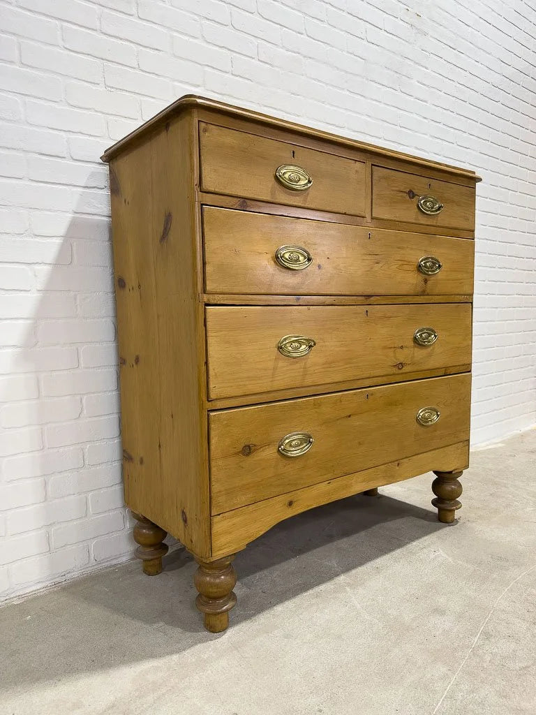 Antique English pine dresser with oval brasses