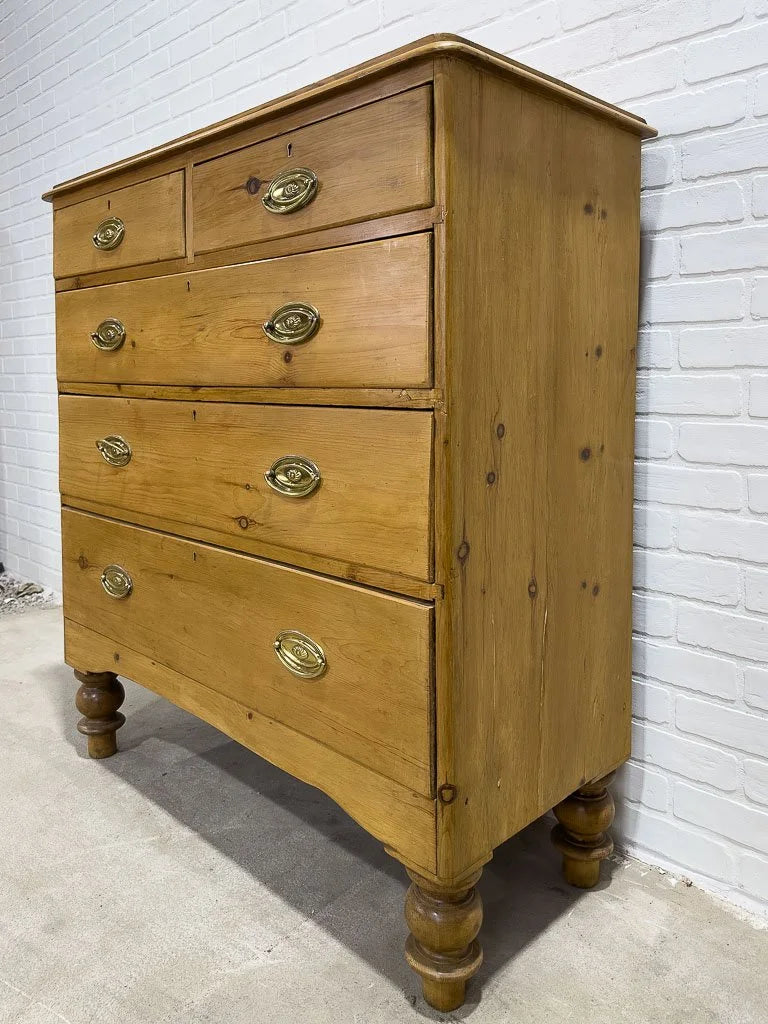 Antique English pine dresser with oval brasses