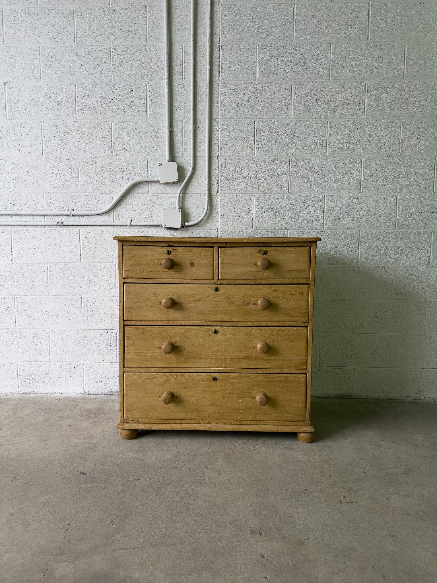Light colored English antique pine drawers