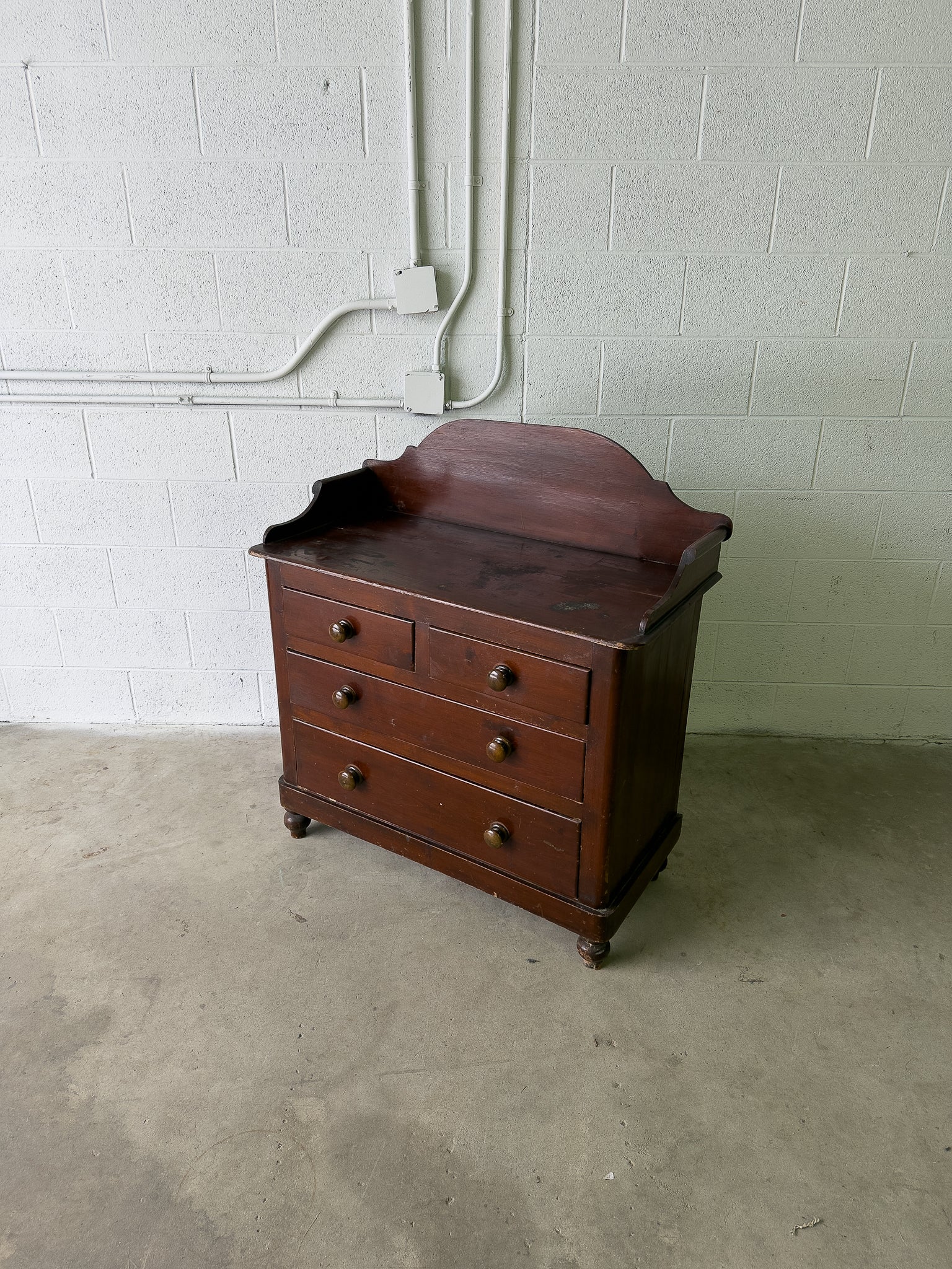 Stained antique pine chest of drawers