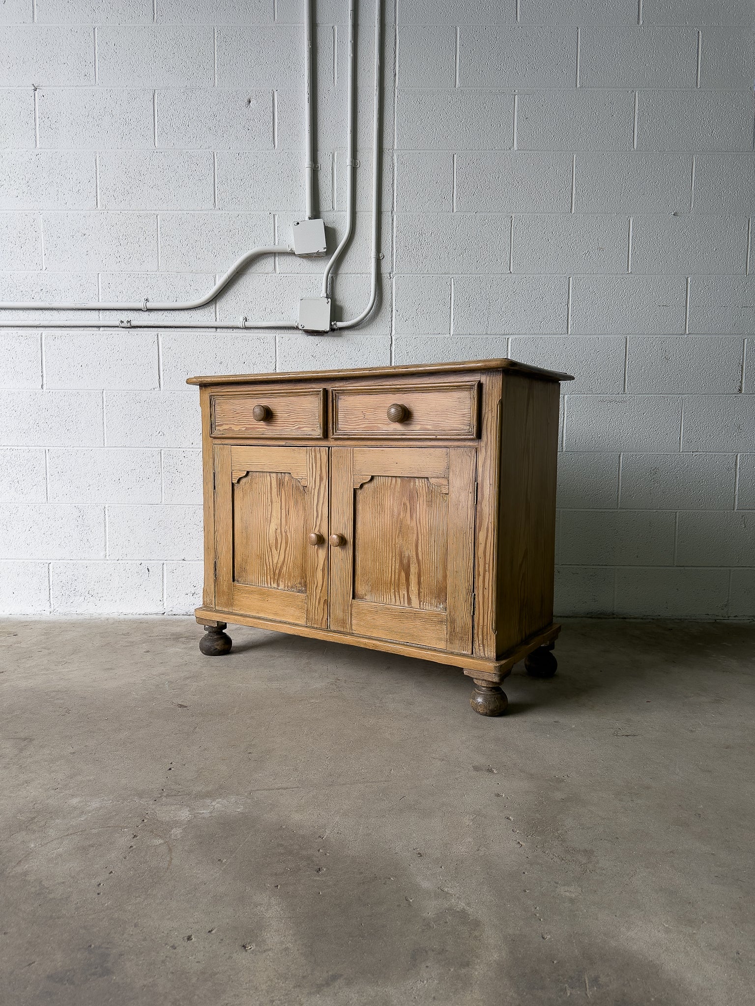 Petite antique pine sideboard with two doors