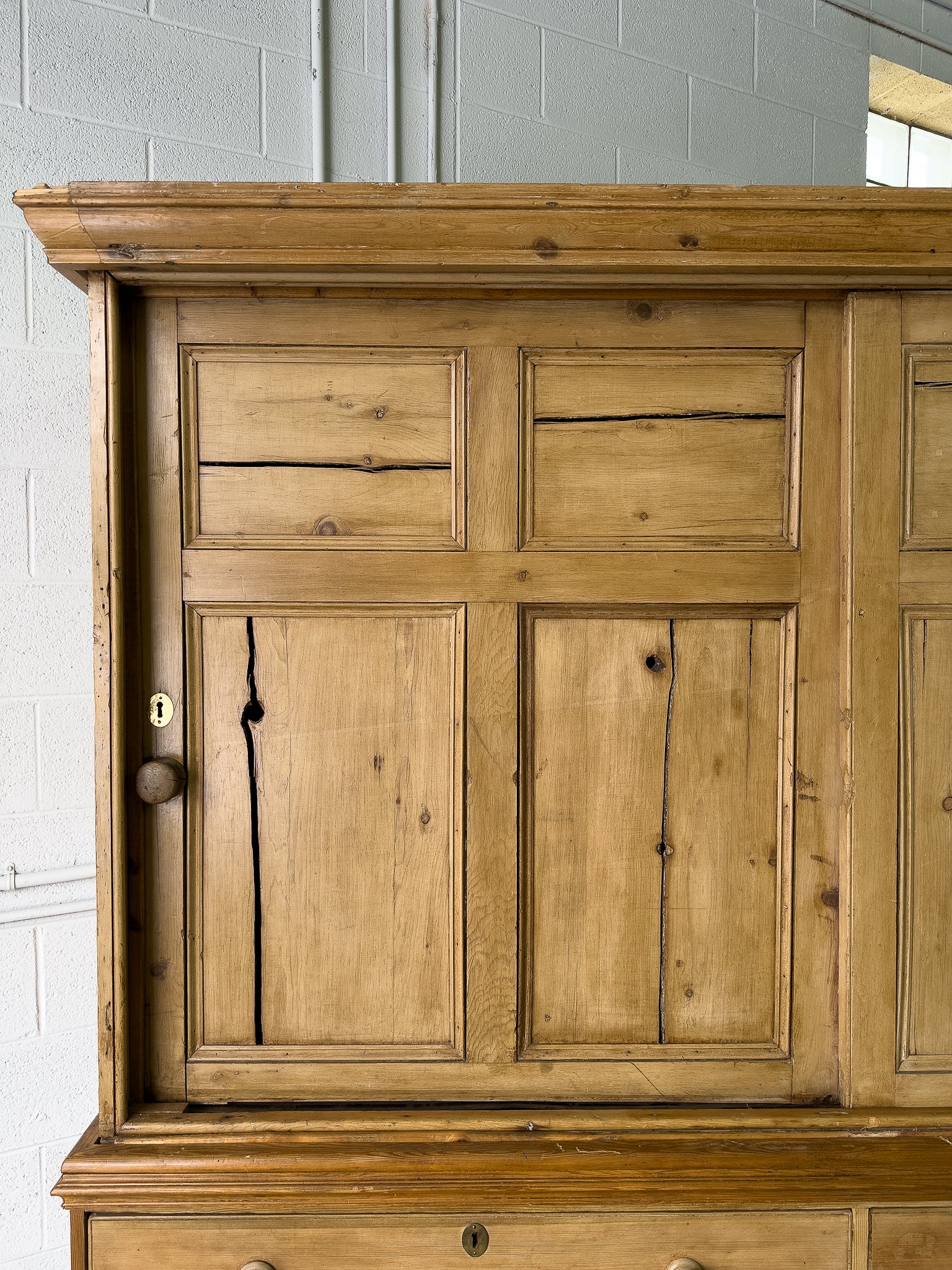 Large antique pine housekeepers cupboard with sliding doors
