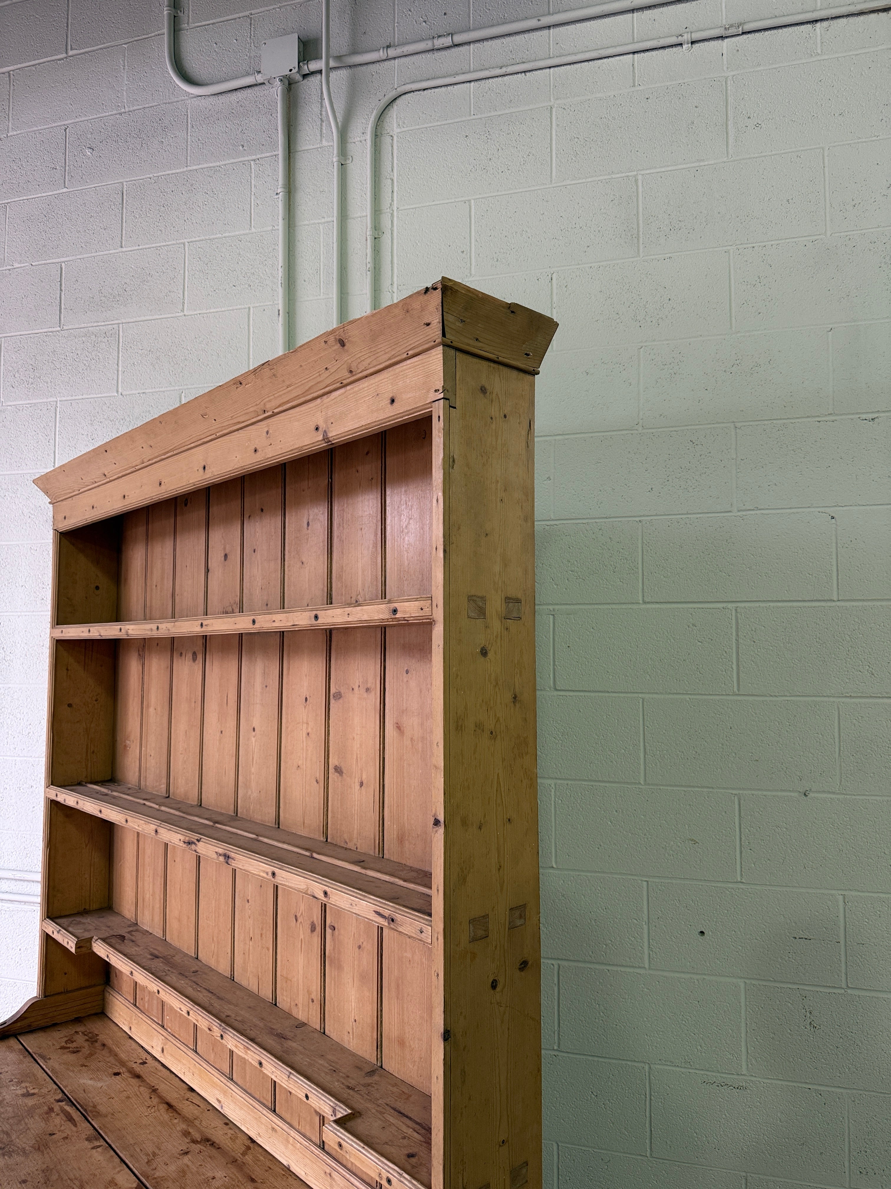 Striking antique pine kitchen dresser with brass pulls