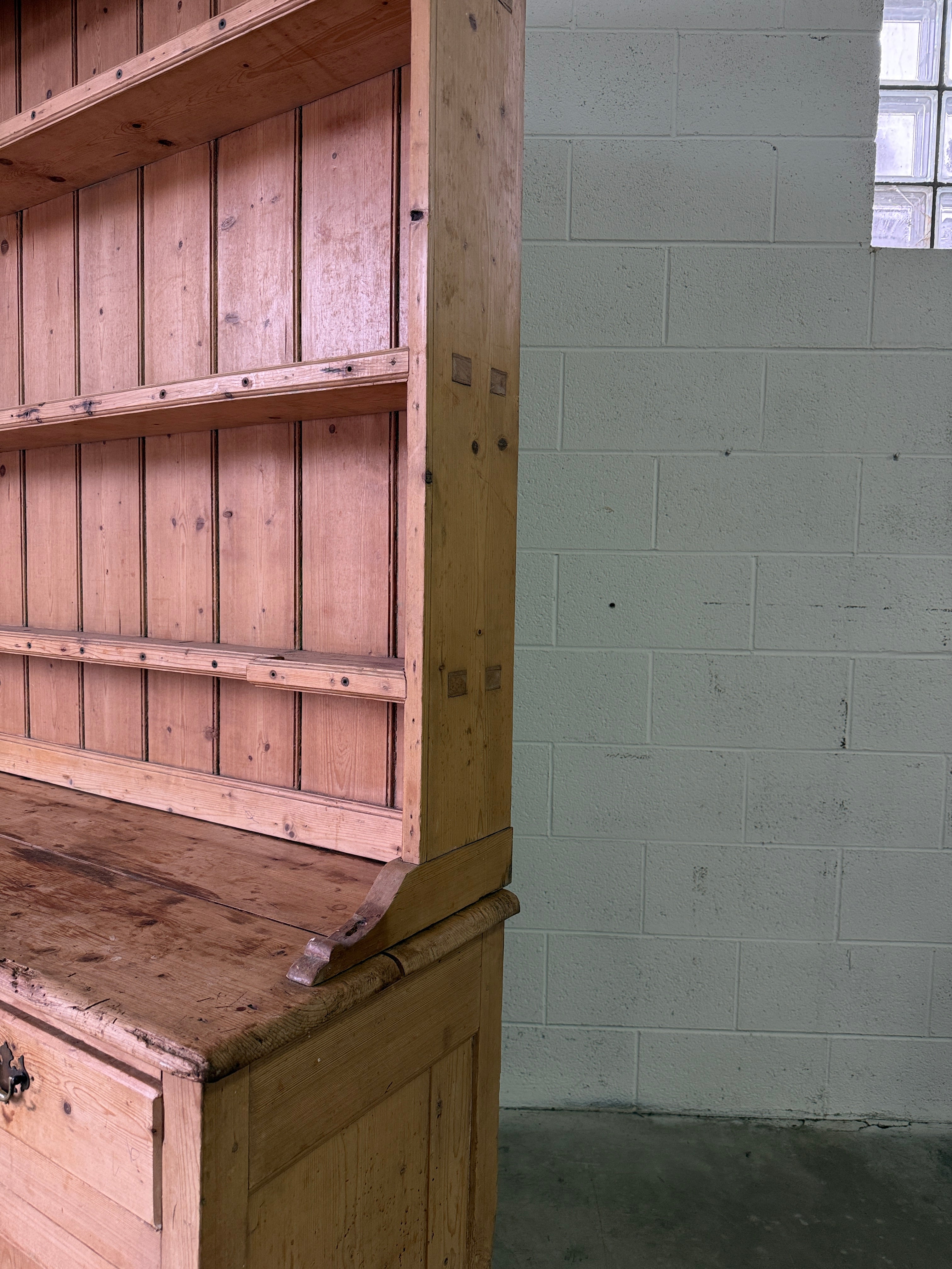 Striking antique pine kitchen dresser with brass pulls