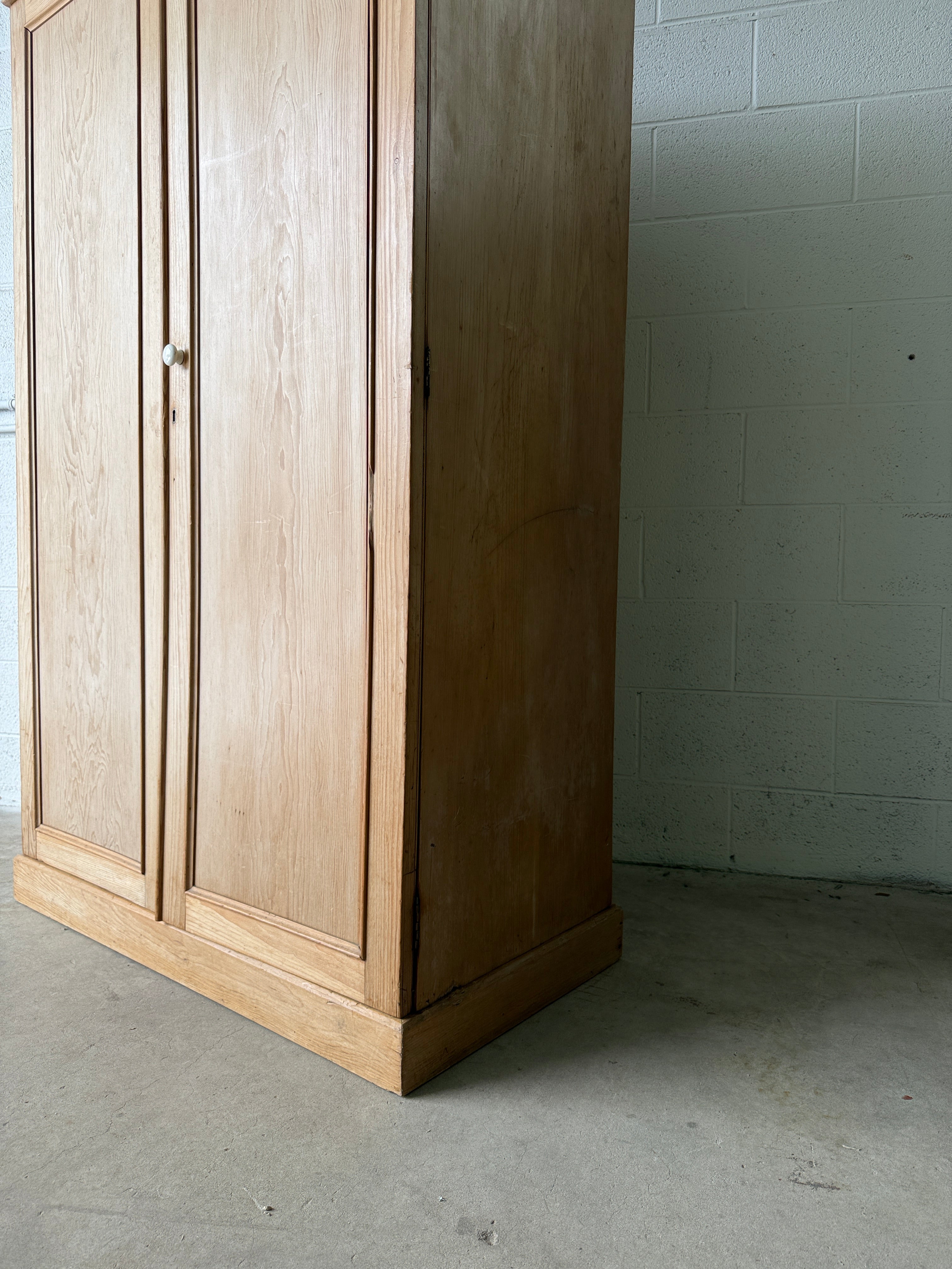 Modest antique English pine wardrobe