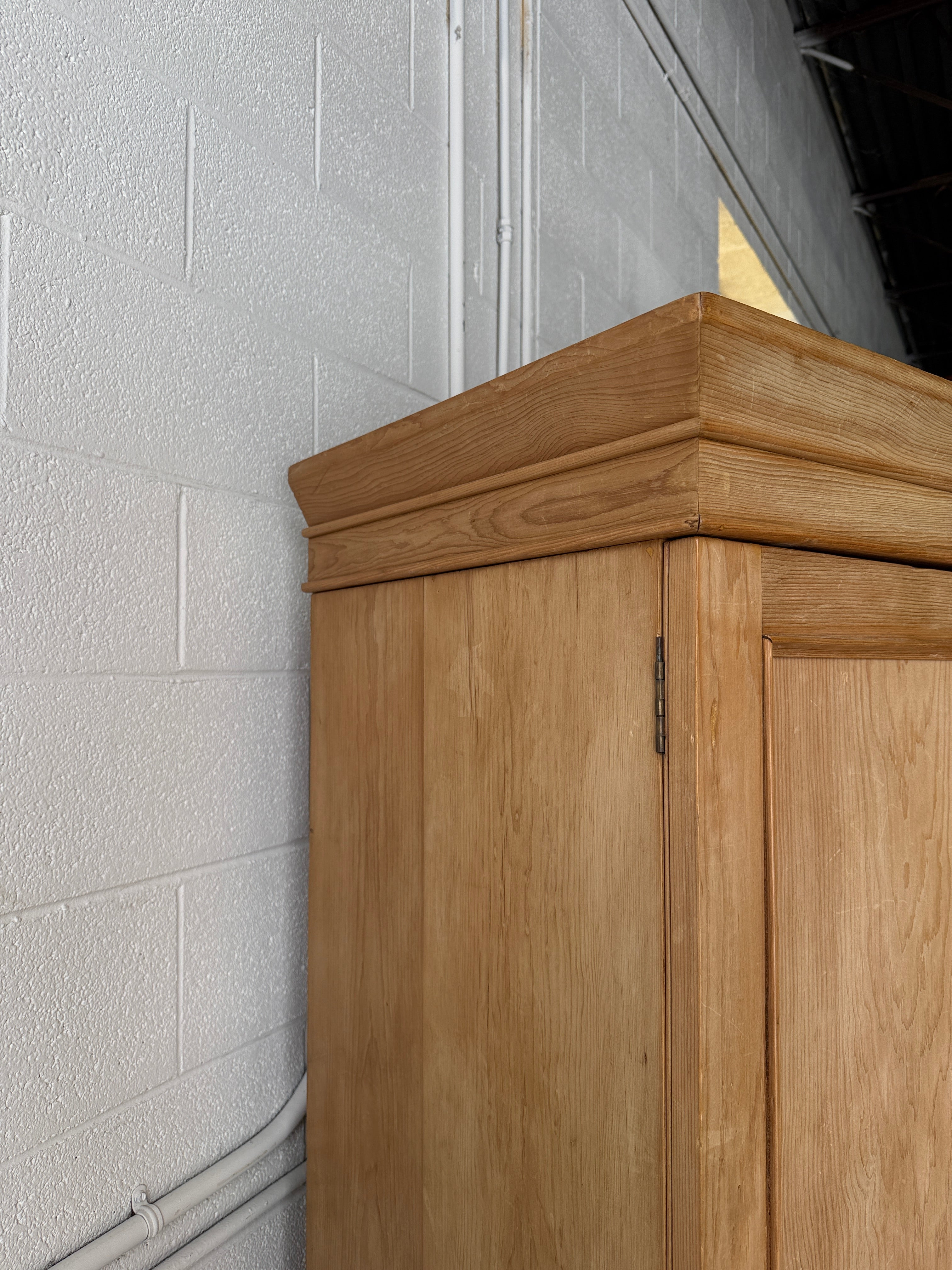 Modest antique English pine wardrobe