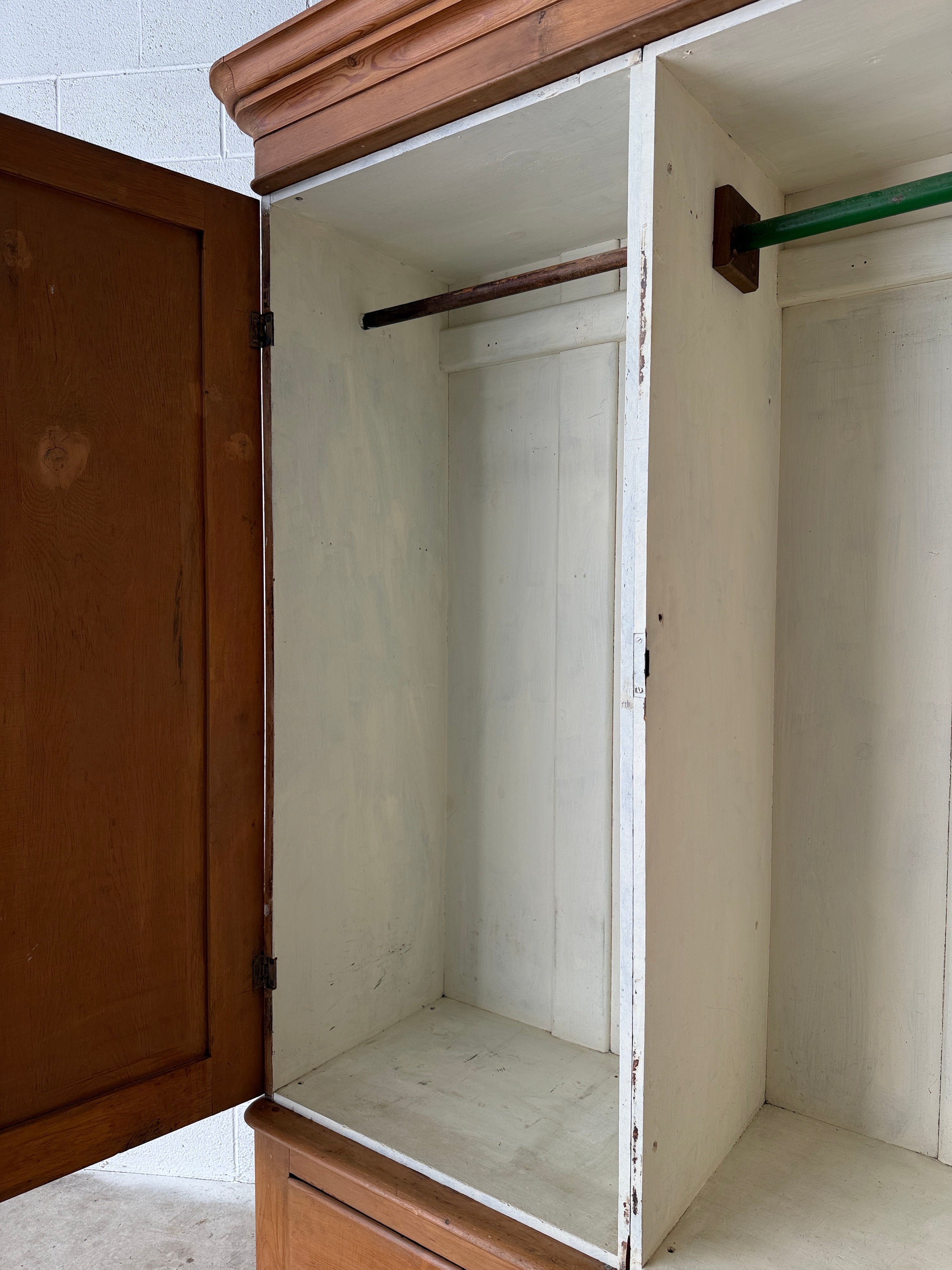 Substantial antique pine double wardrobe with painted interior