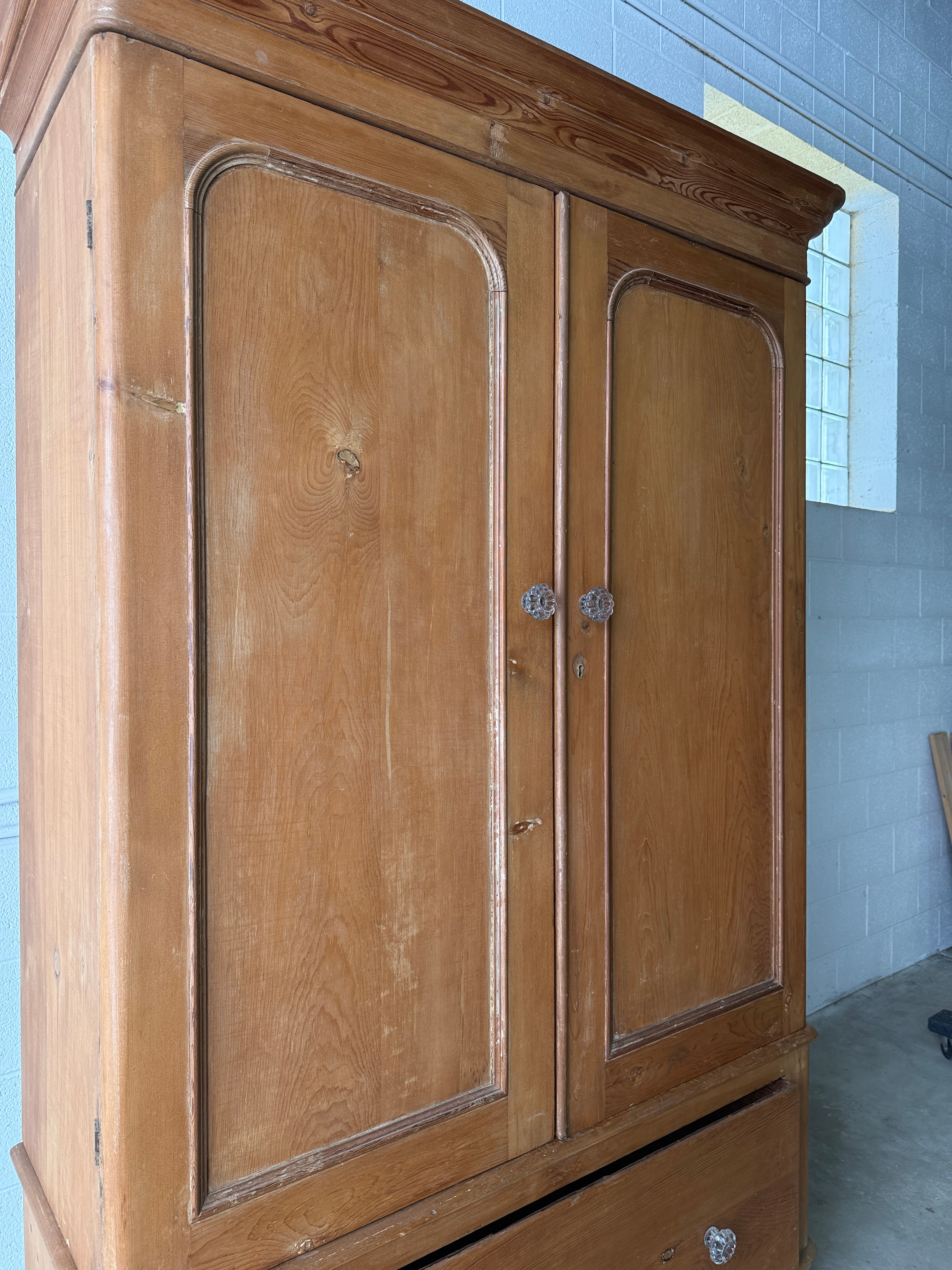 Substantial antique pine double wardrobe with painted interior