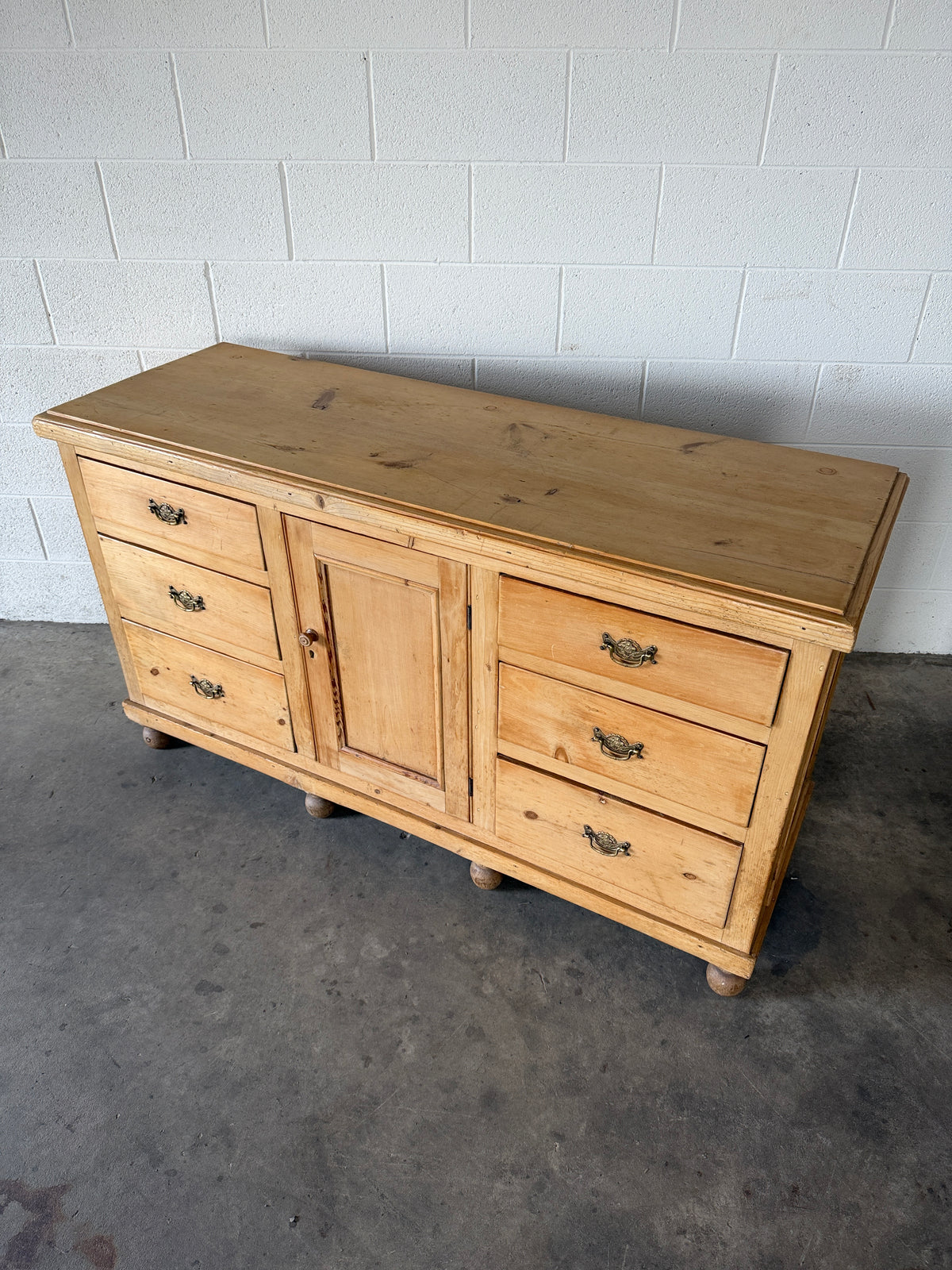 English pine sideboard with decorative pulls