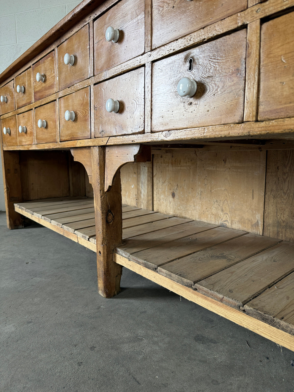 English antique pine shop counter with 15 drawers