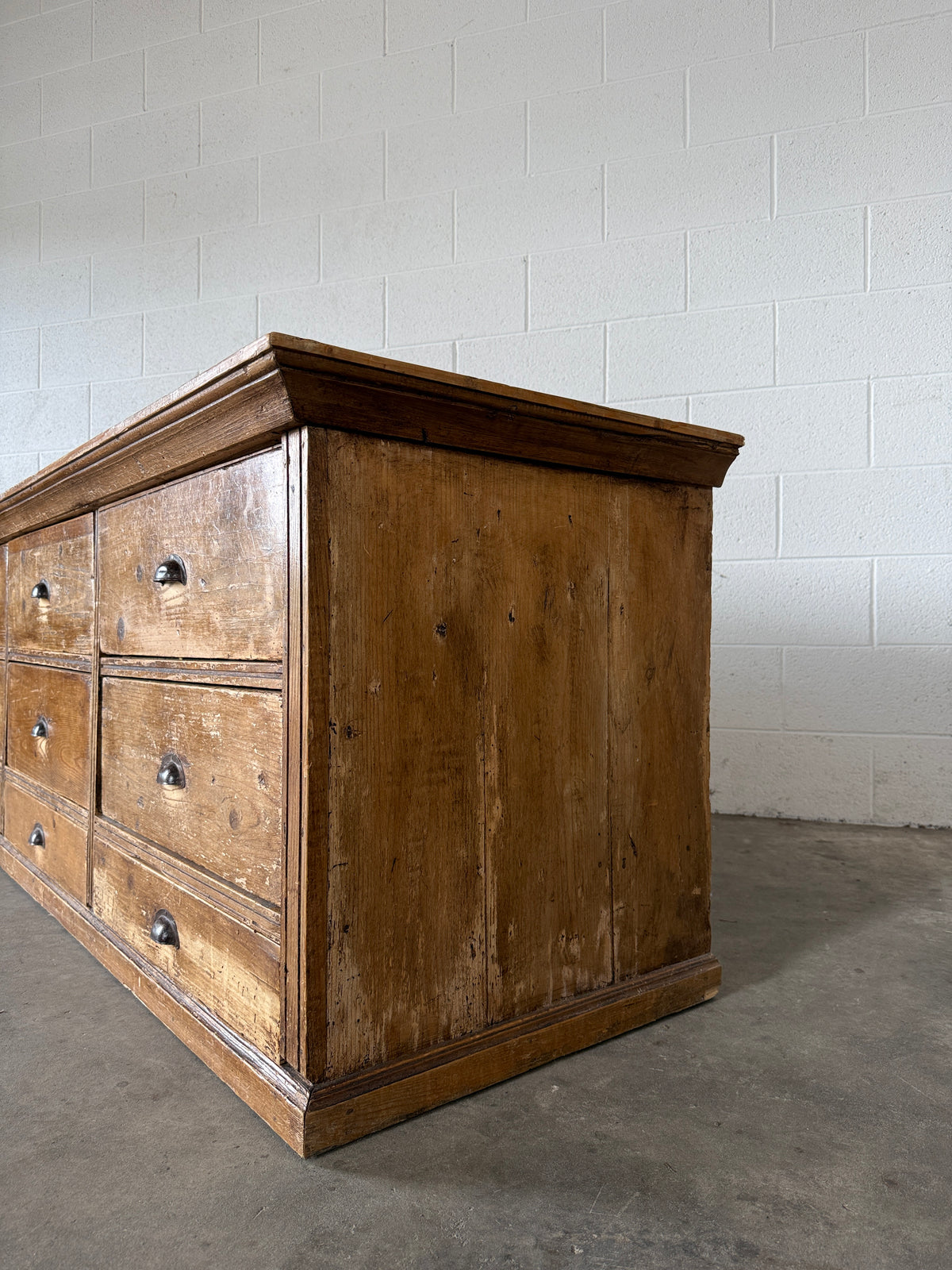 Low bank of 9 antique European drawers