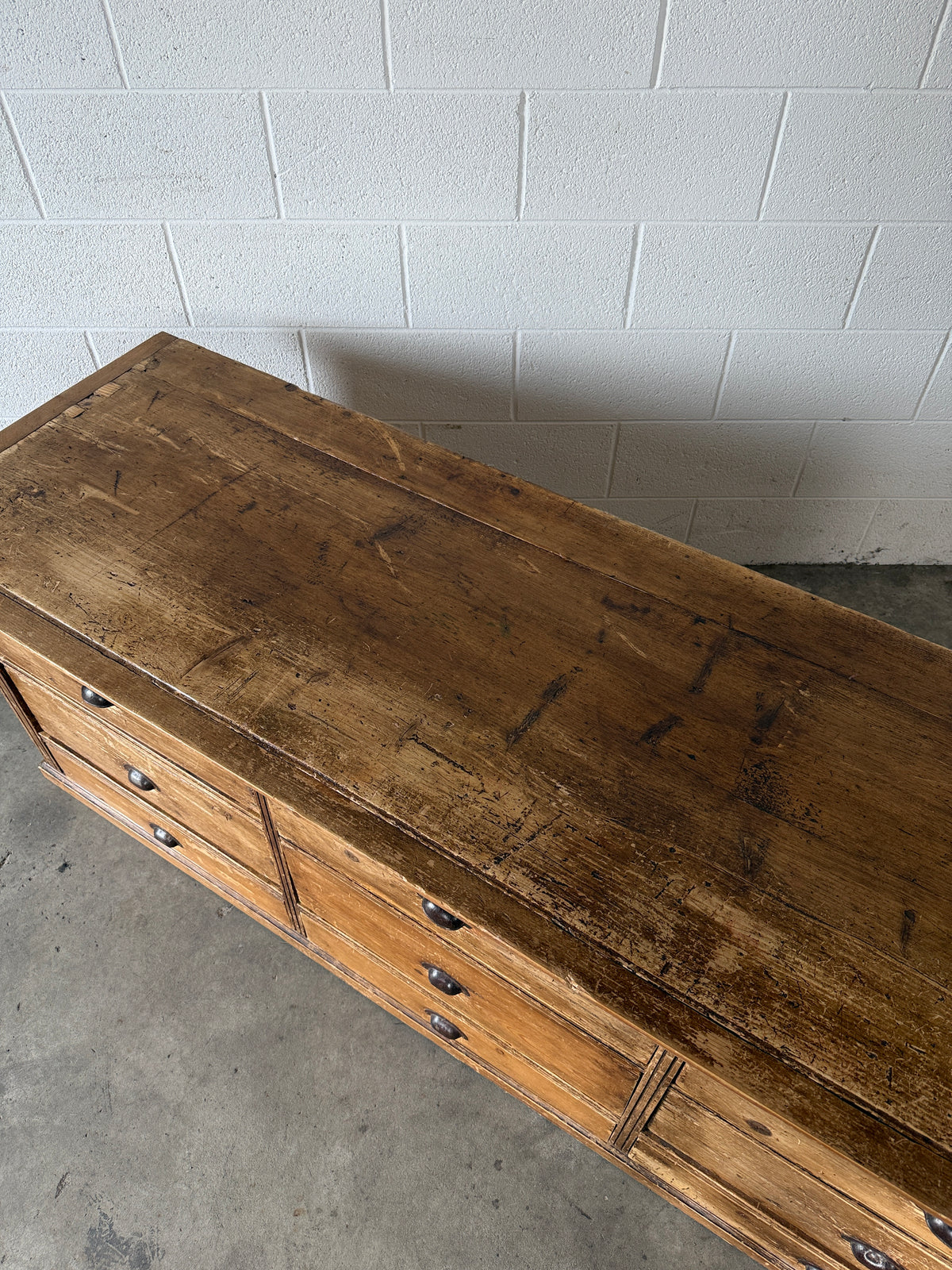 Low bank of 9 antique European drawers