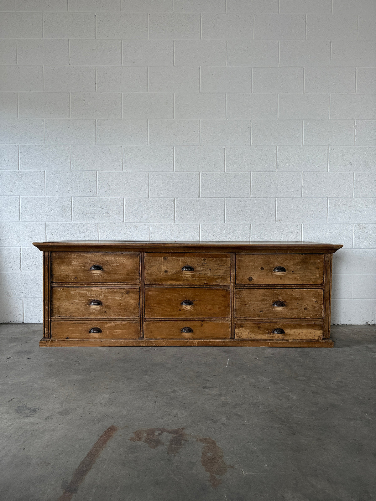 Low bank of 9 antique European drawers