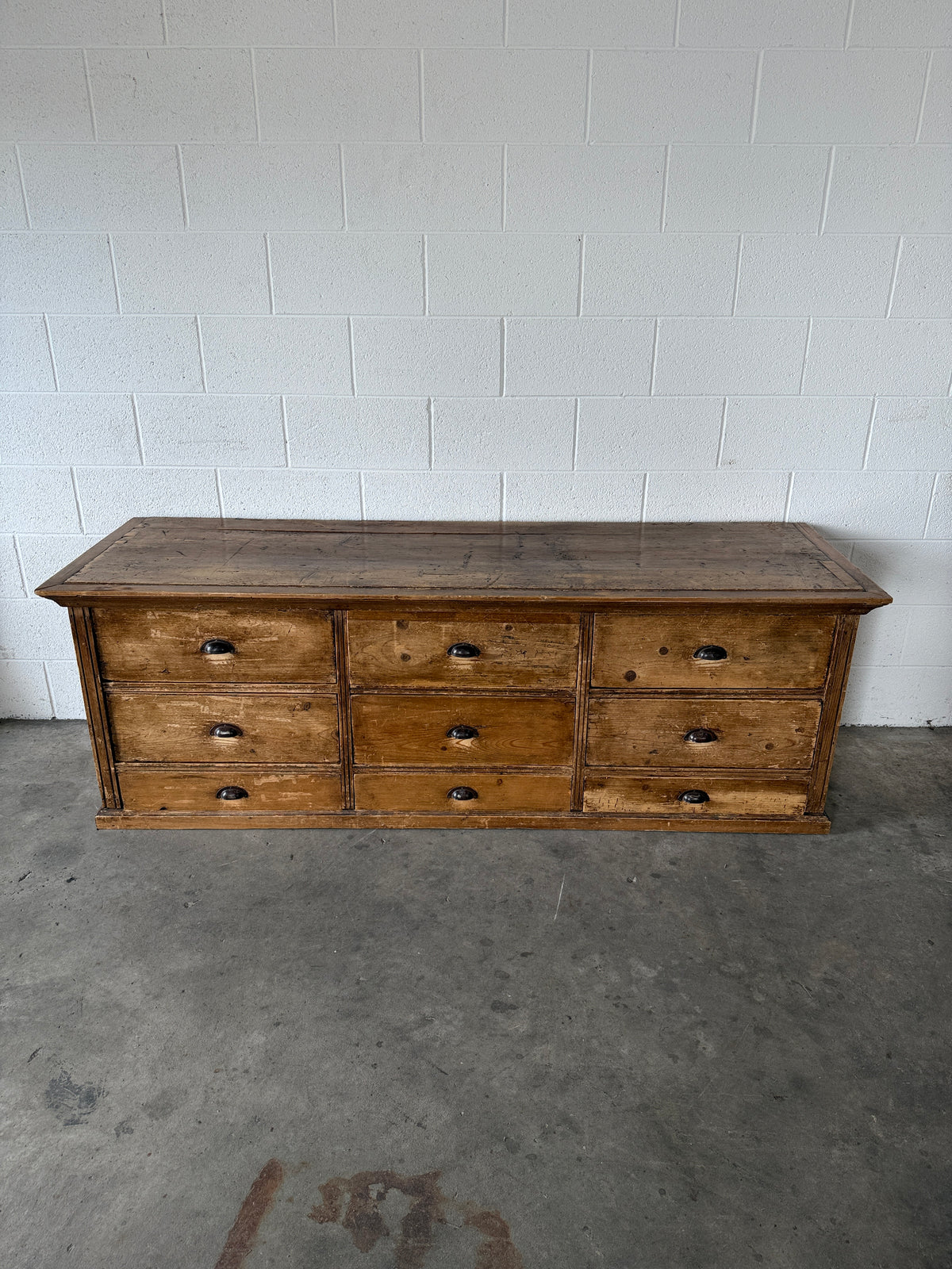 Low bank of 9 antique European drawers