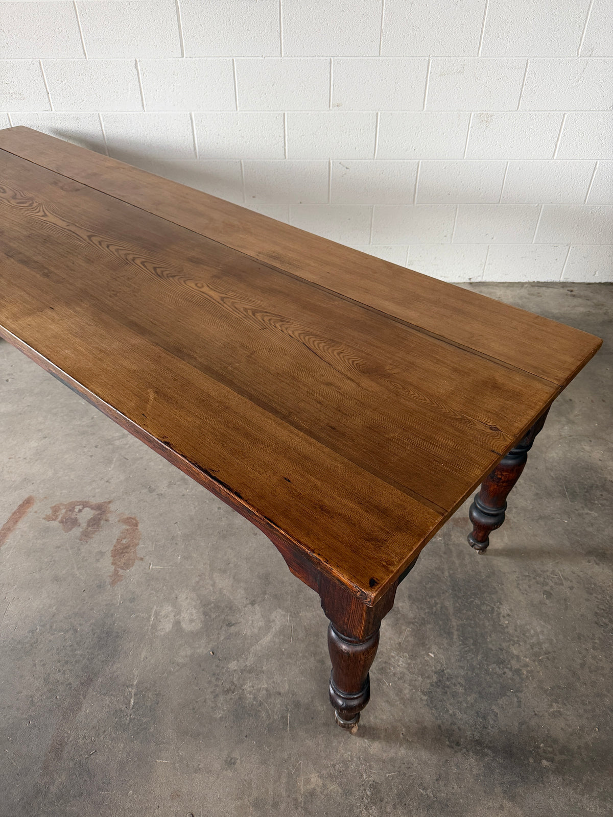 Victorian pine dining table with dark finish