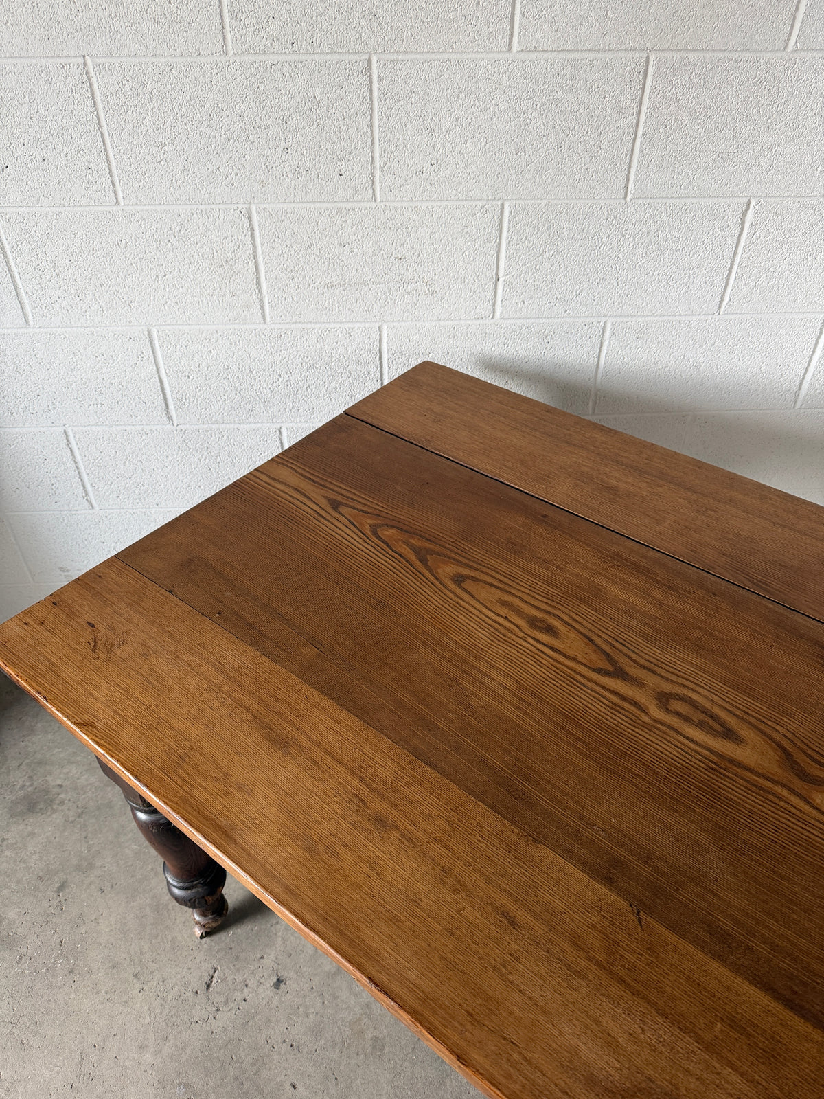 Victorian pine dining table with dark finish