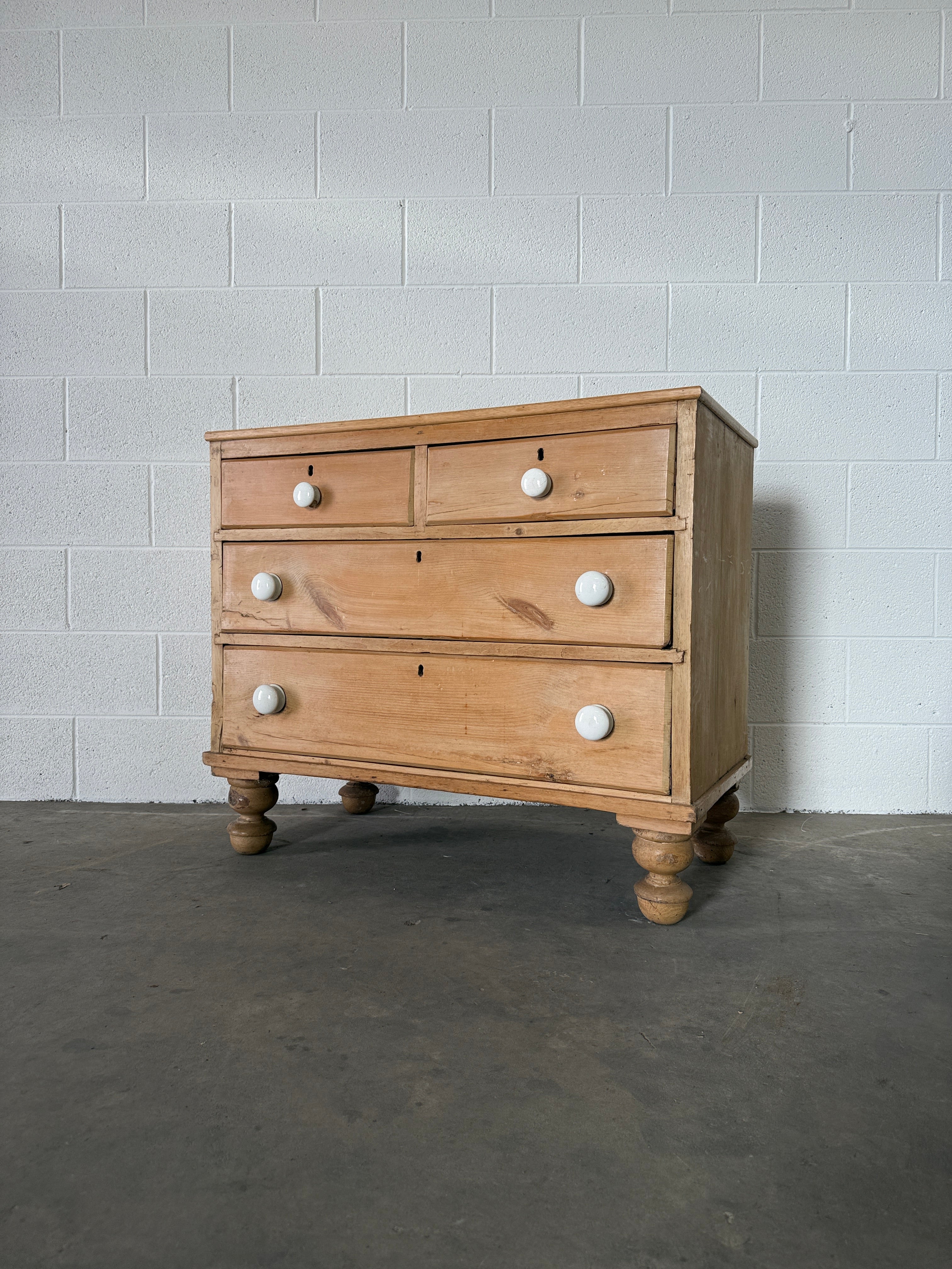 Petite pine chest of drawers with original porcelain knobs