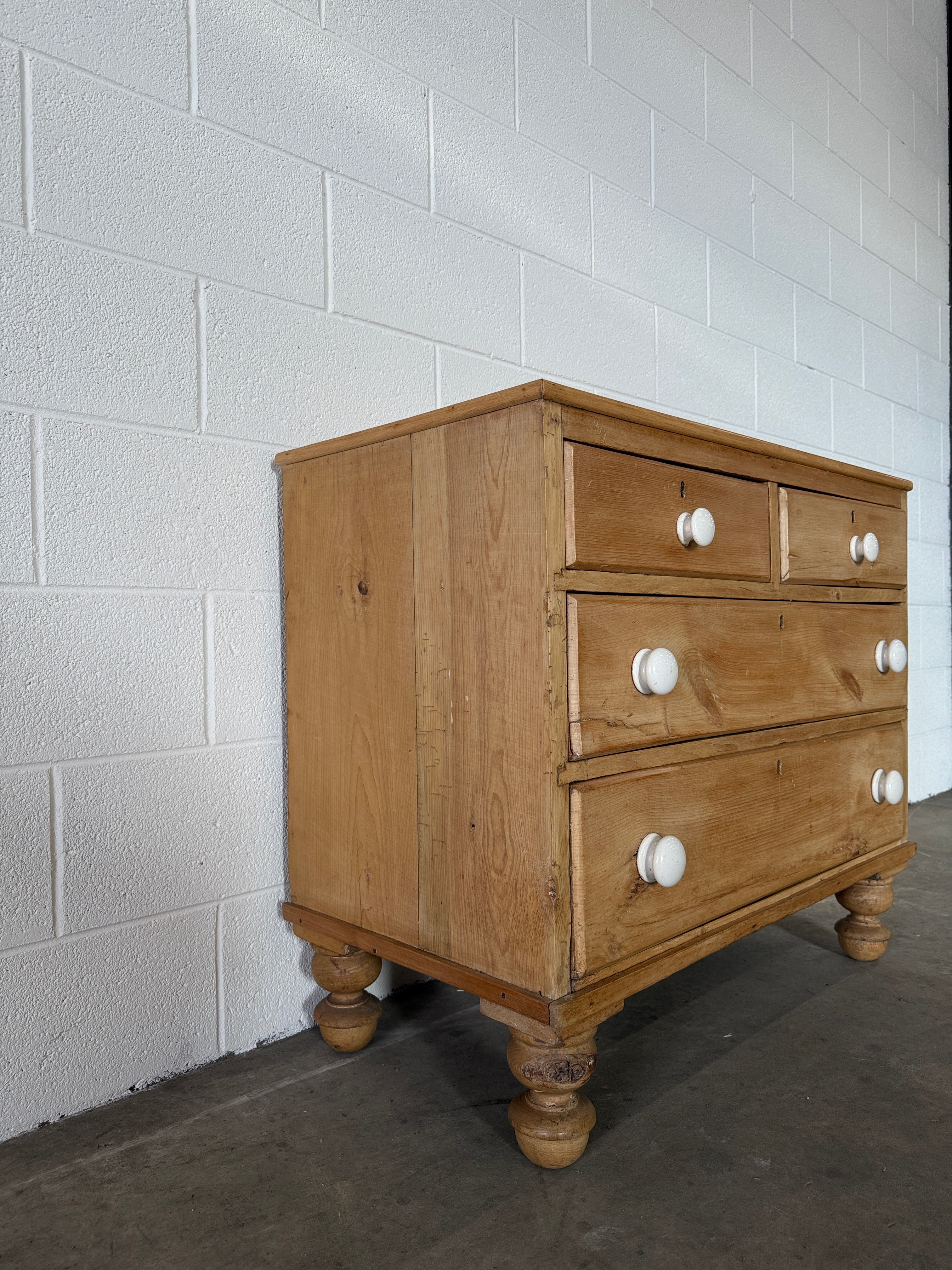 Petite pine chest of drawers with original porcelain knobs