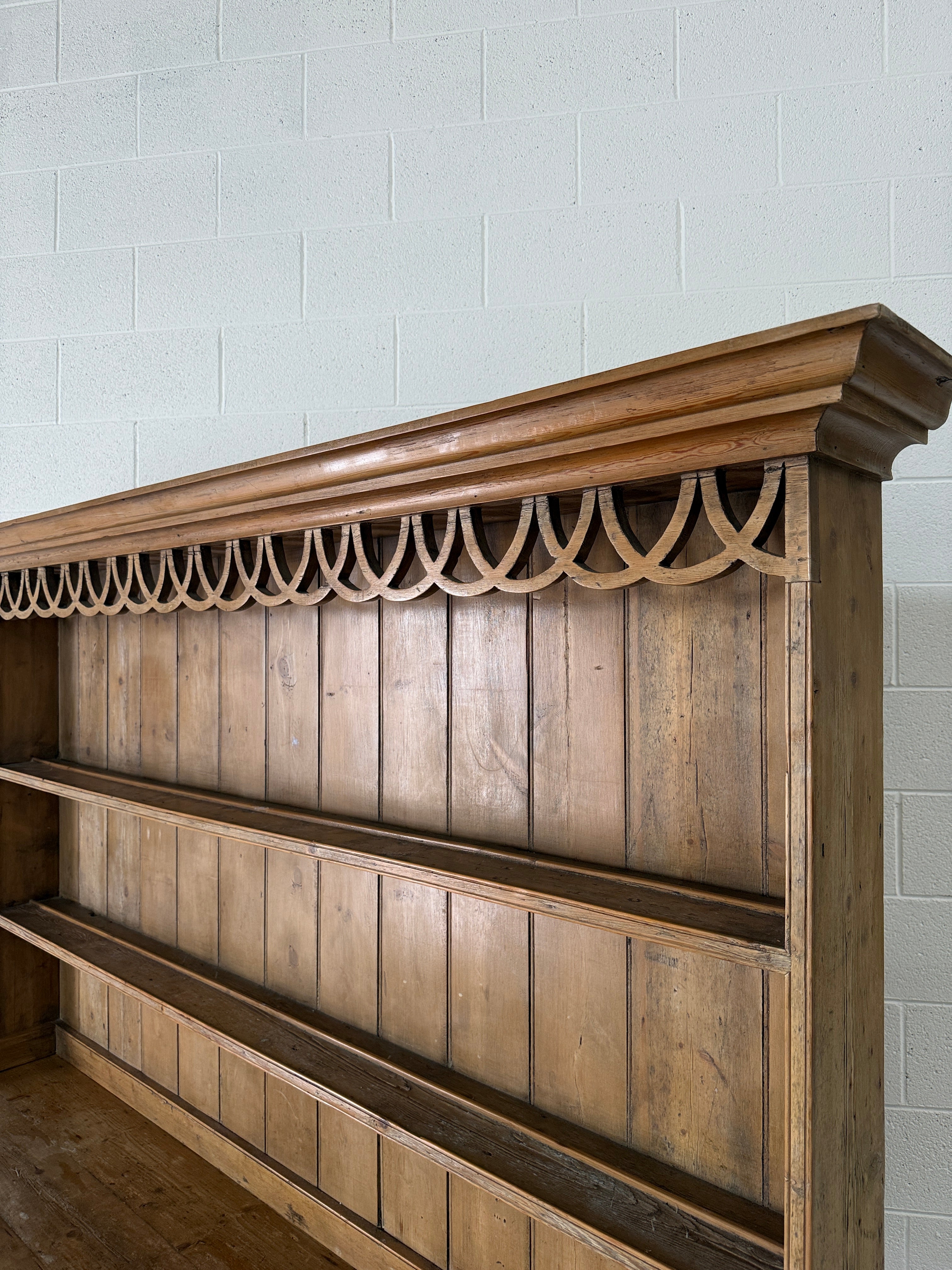 Antique pine kitchen dresser with decorative top
