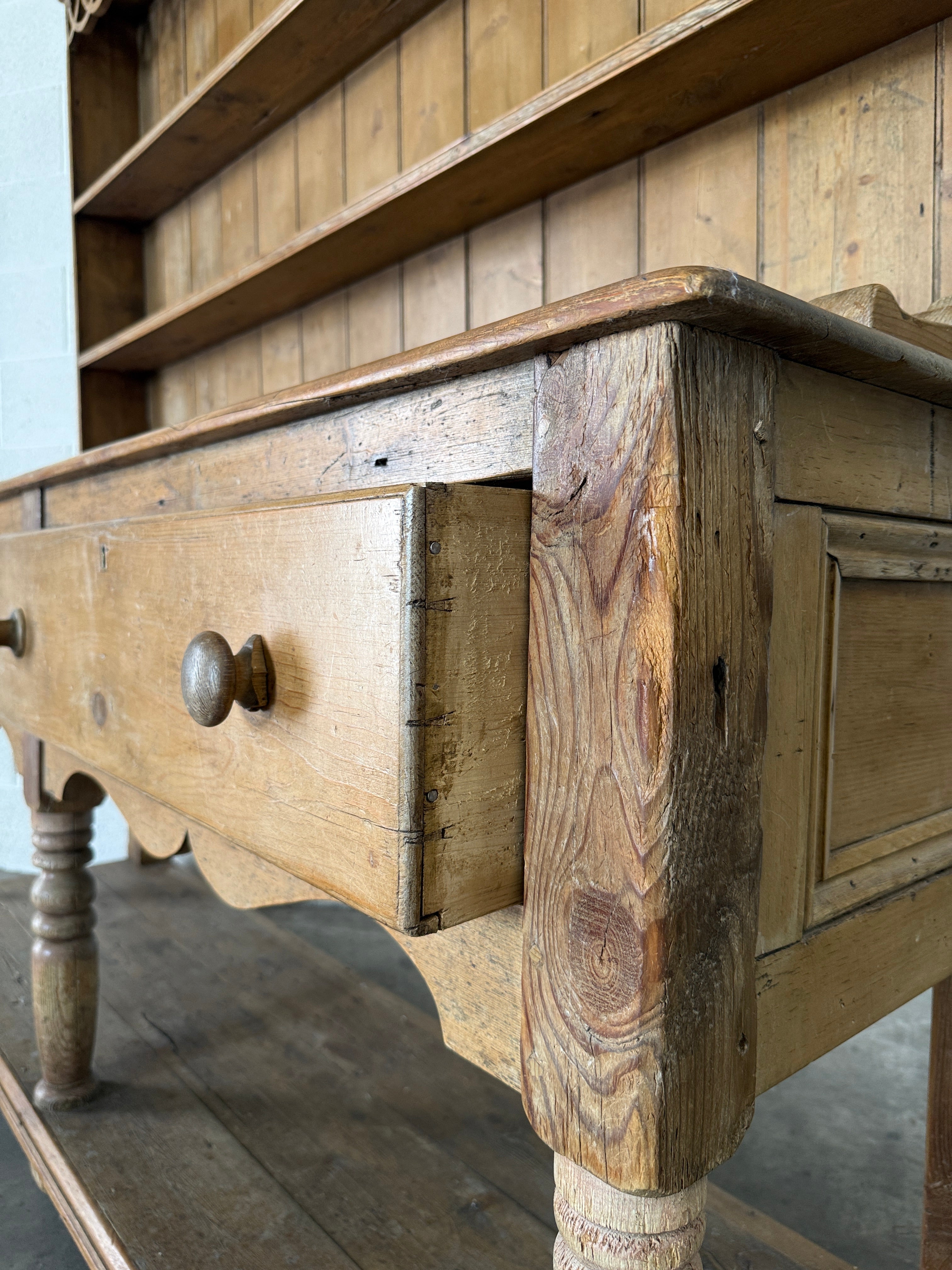Antique pine kitchen dresser with decorative top