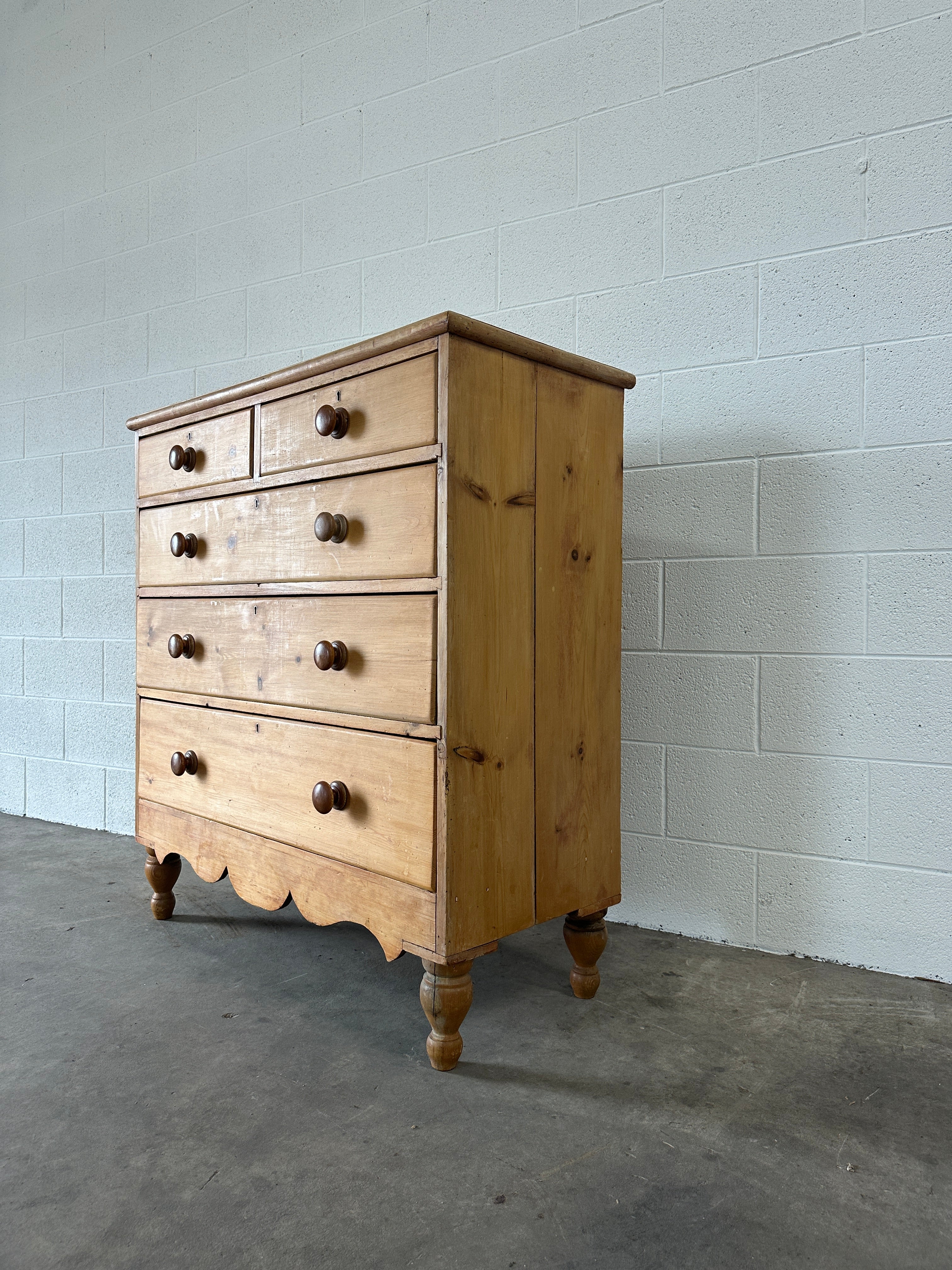 Tall English pine drawers with a scalloped apron
