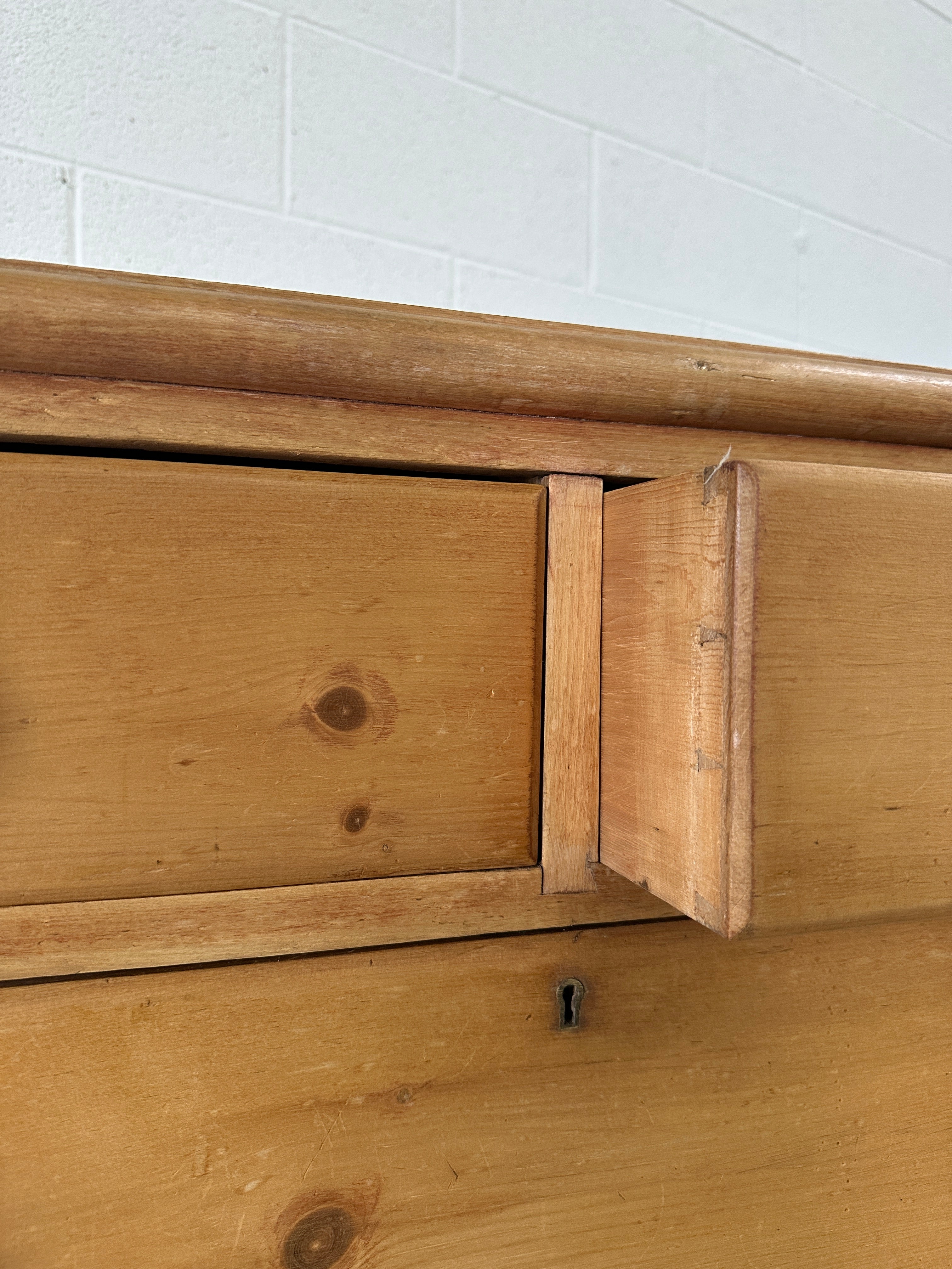Tall English pine drawers with a scalloped apron