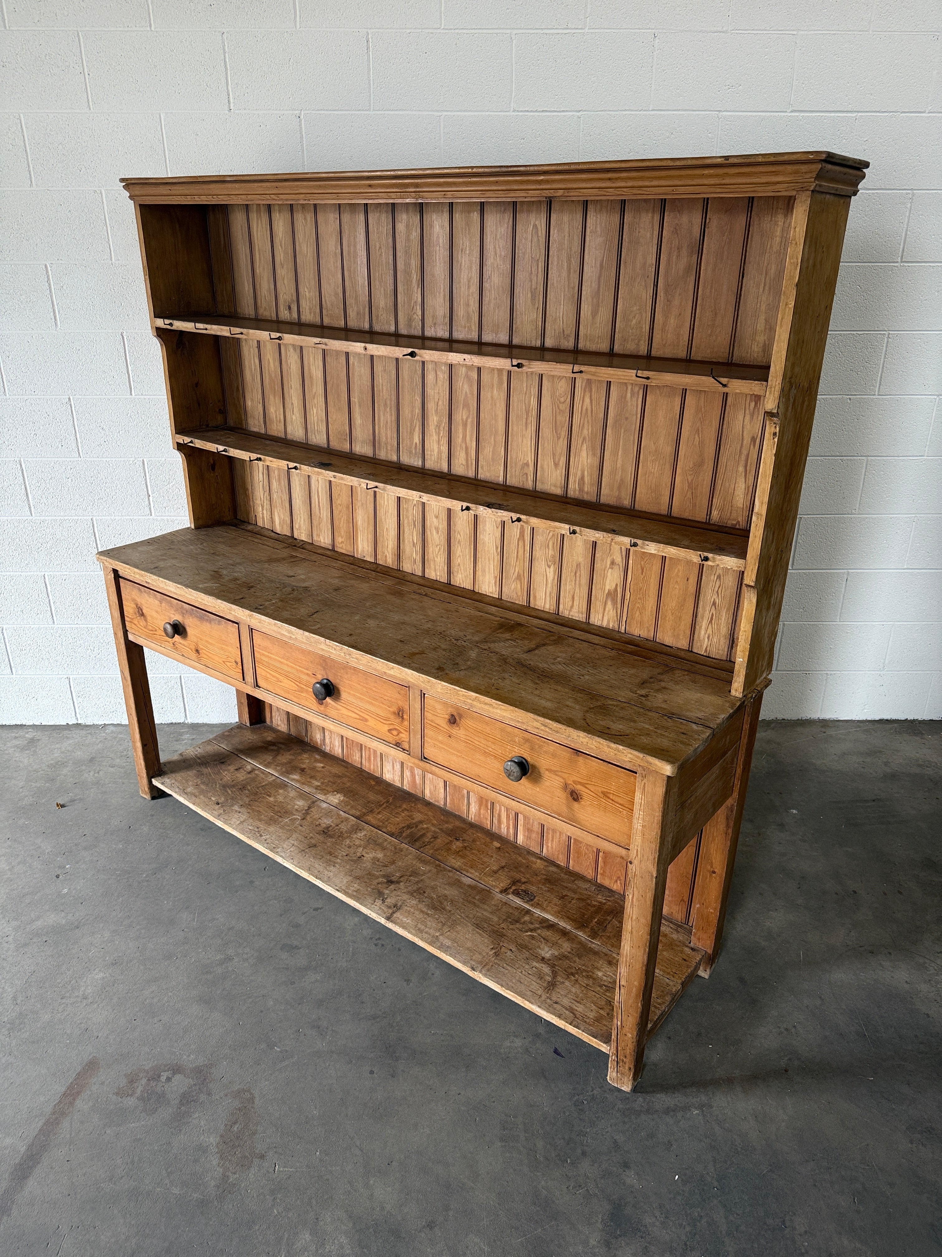 Simple antique English pine kitchen dresser with potboard base