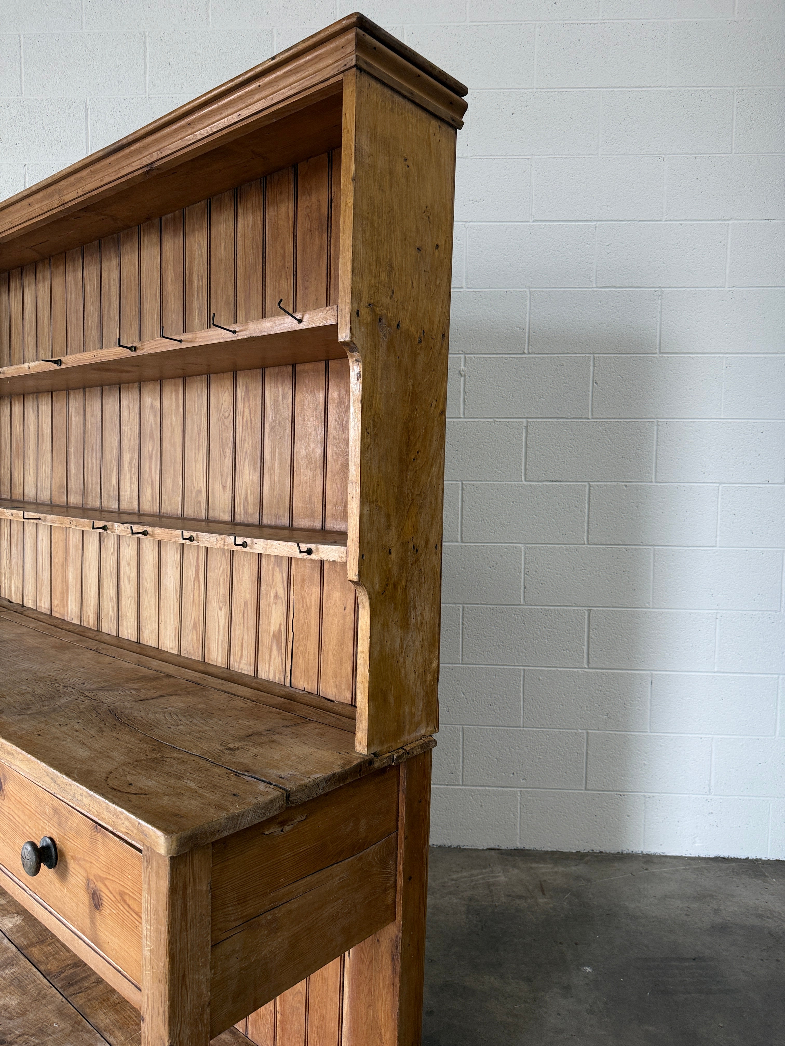 Simple antique English pine kitchen dresser with potboard base