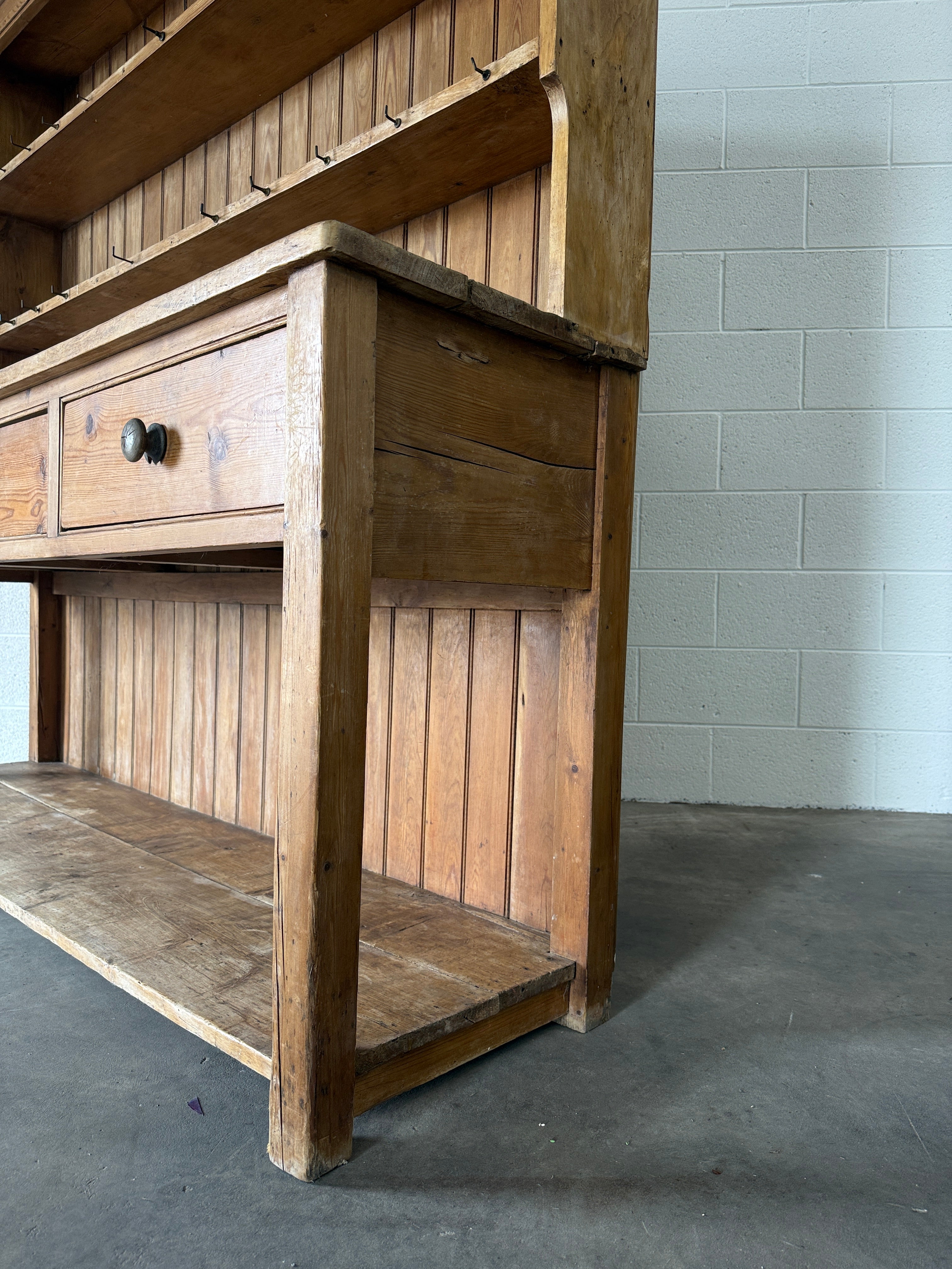 Simple antique English pine kitchen dresser with potboard base