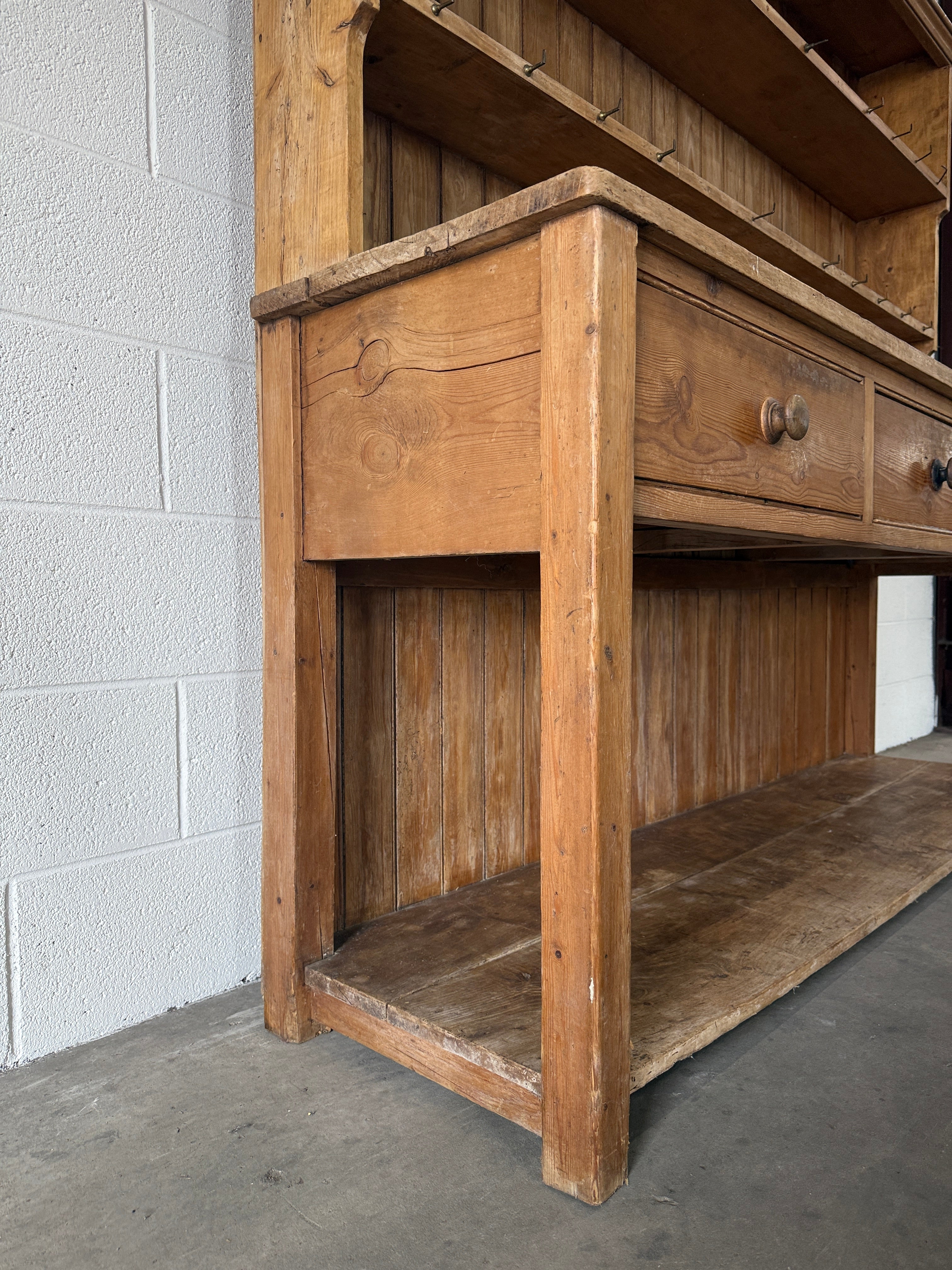 Simple antique English pine kitchen dresser with potboard base