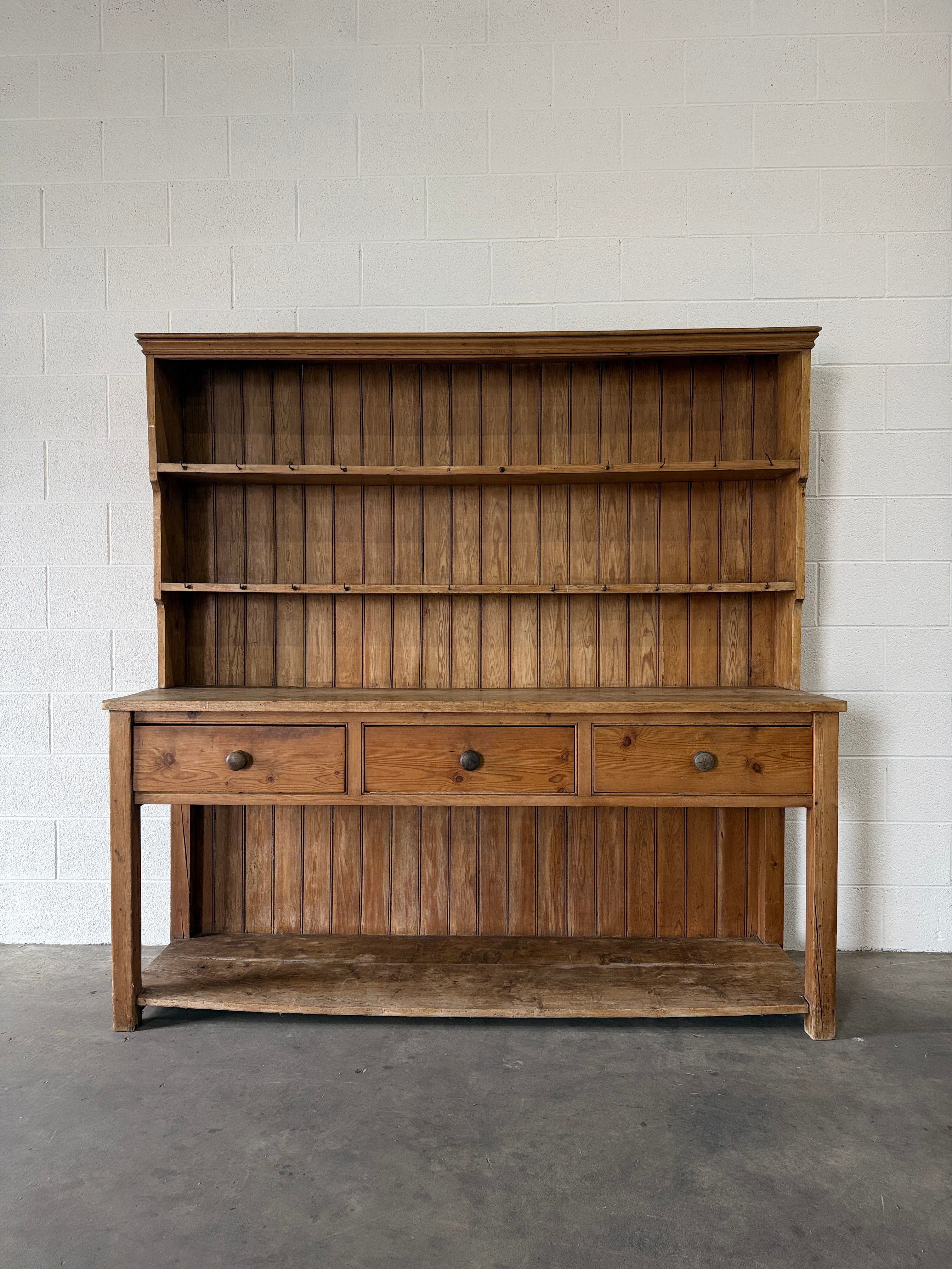 Simple antique English pine kitchen dresser with potboard base